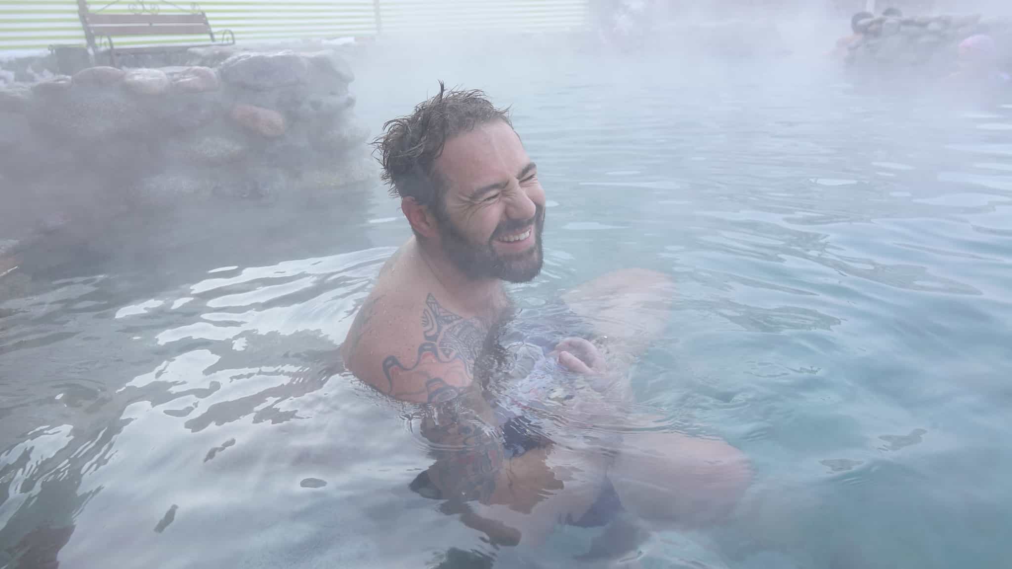 Man enjoying the hot springs at Kermet Suu, Kyrgyzstan