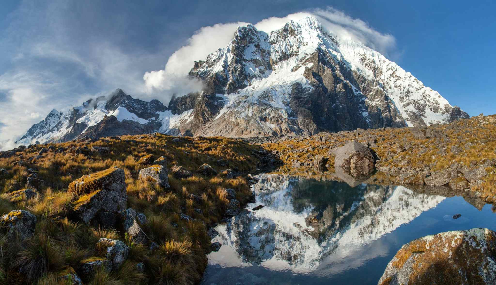 Reflection of Mt Salkantay in a lake on the Salkantay Trek in Peru.