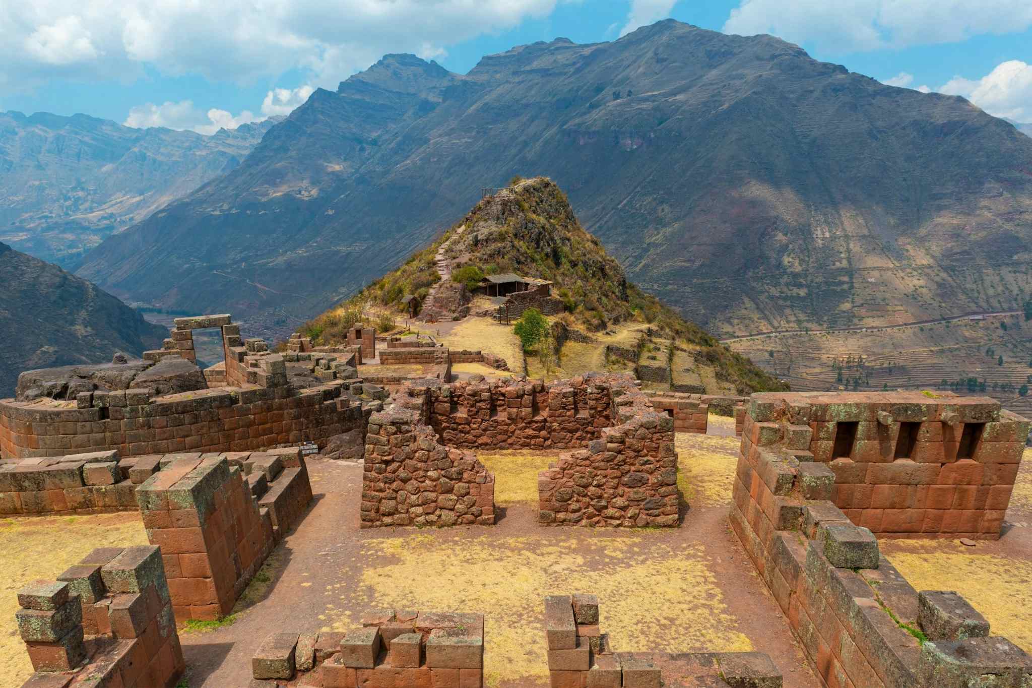 Pisca ruins overlooking the Andes mountains behind in Peru