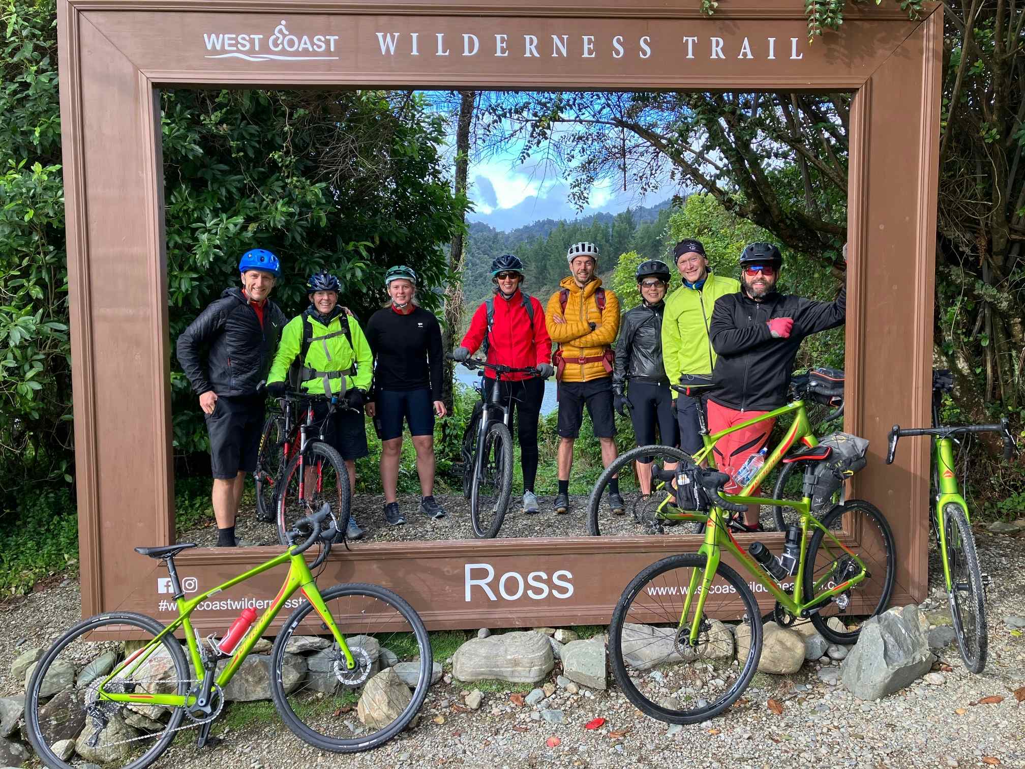 Cyclists at the start point of the West Coast Wilderness Trail on New Zealand's South Island
