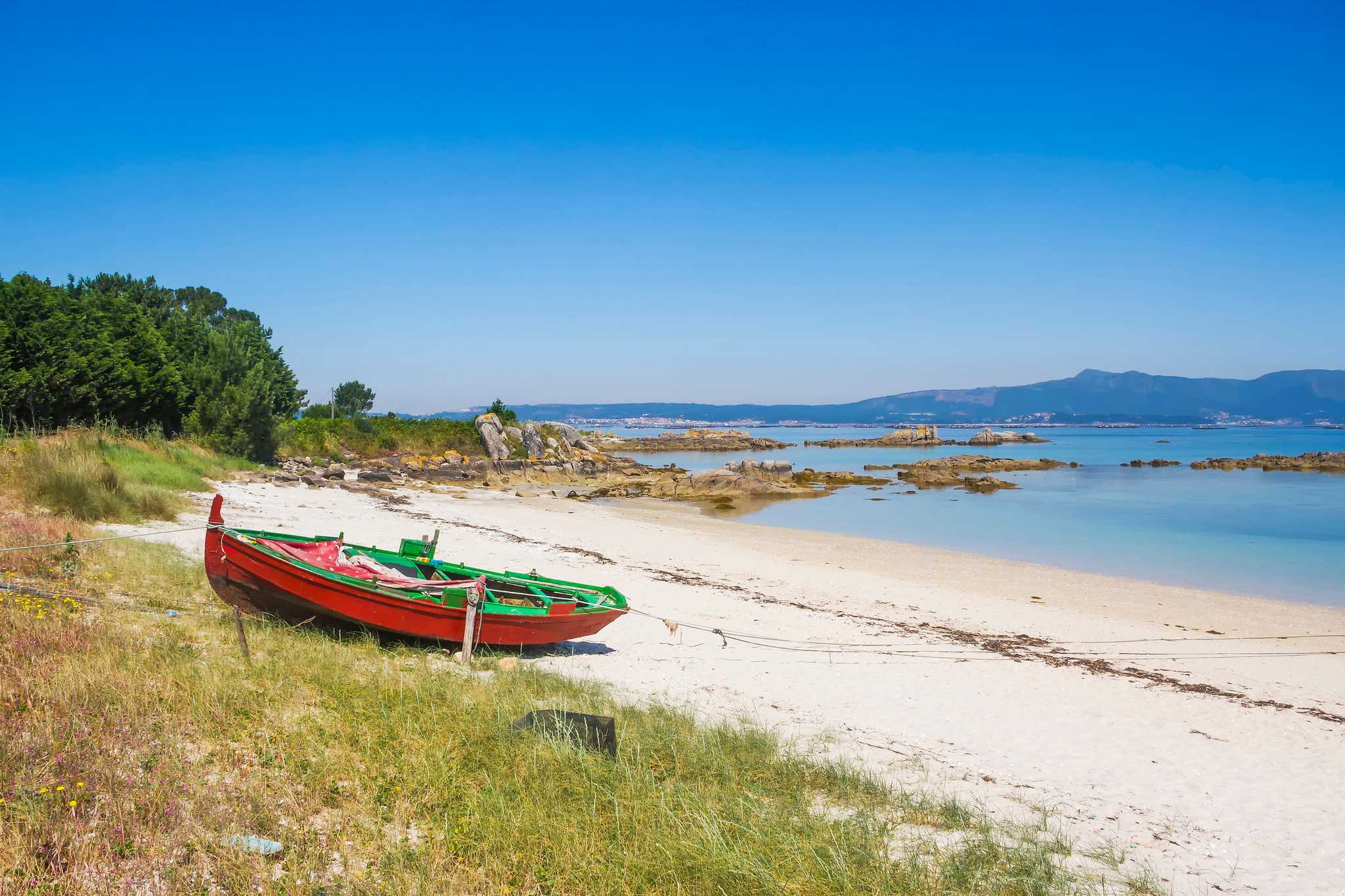 Old fishing boat on a beach on Arousa Island, Galicia, Spain