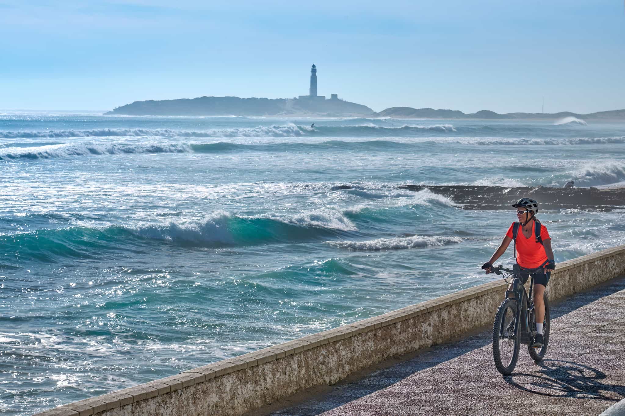 Woman cycling the Trafalgar Route in Andalucia, Spain. 