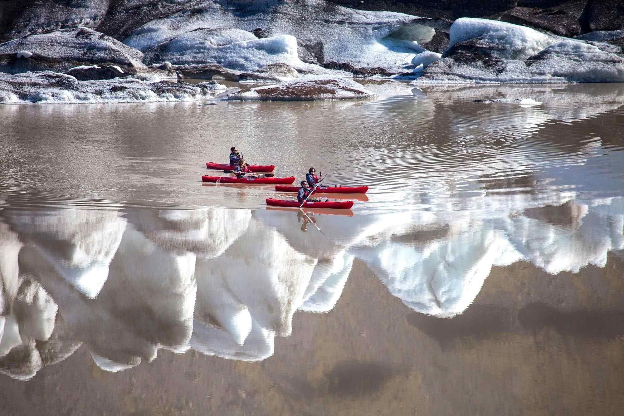 Kayakers on the lagoon at Sólheimajökull glacier, Iceland 
