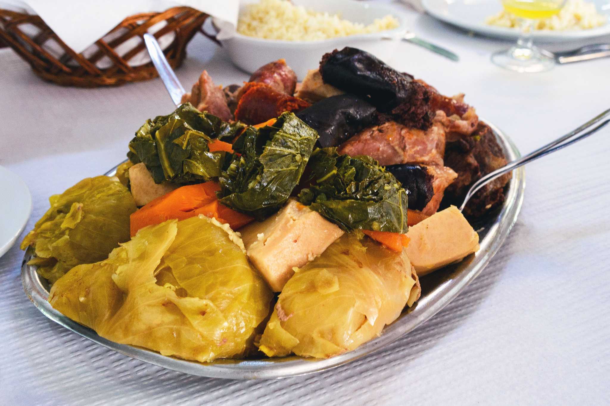 The famous traditional dish of the Azores is Cozido das Furnas. Vegetables and meat are cooked for a long time in hot volcanic soil."r"nTraditional portuguese food, Azores cuisine, San Miguel, Portugal.
