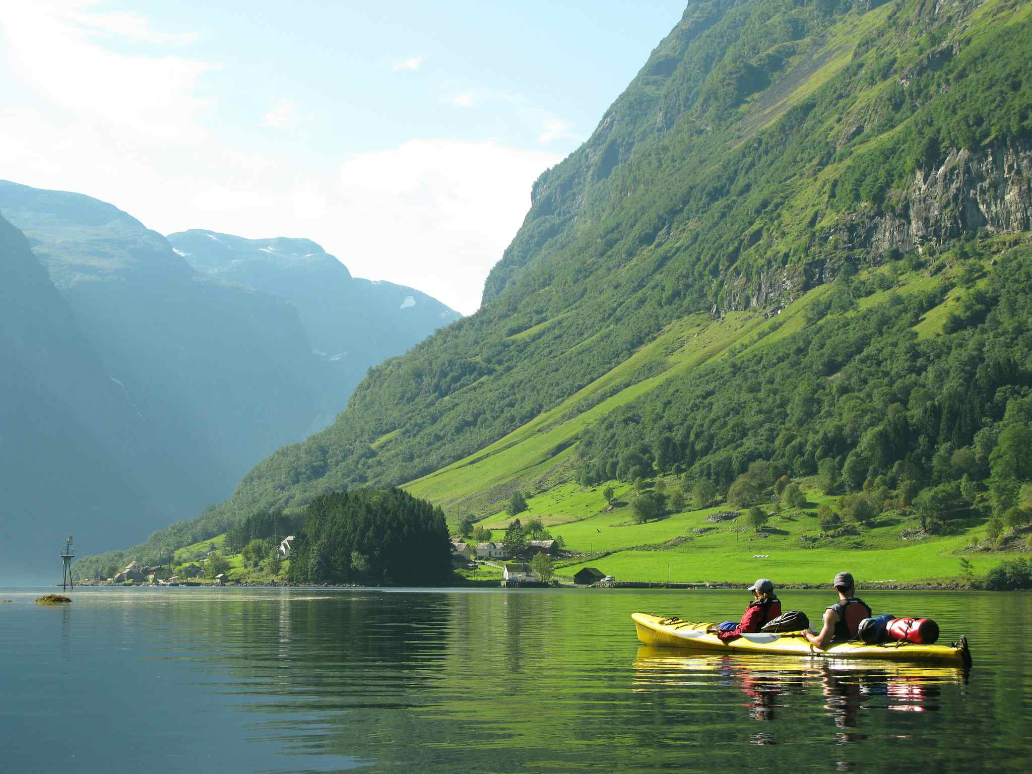 Kayaking the Nærøyfjord in the Norwegian Fjords on a sunny day.