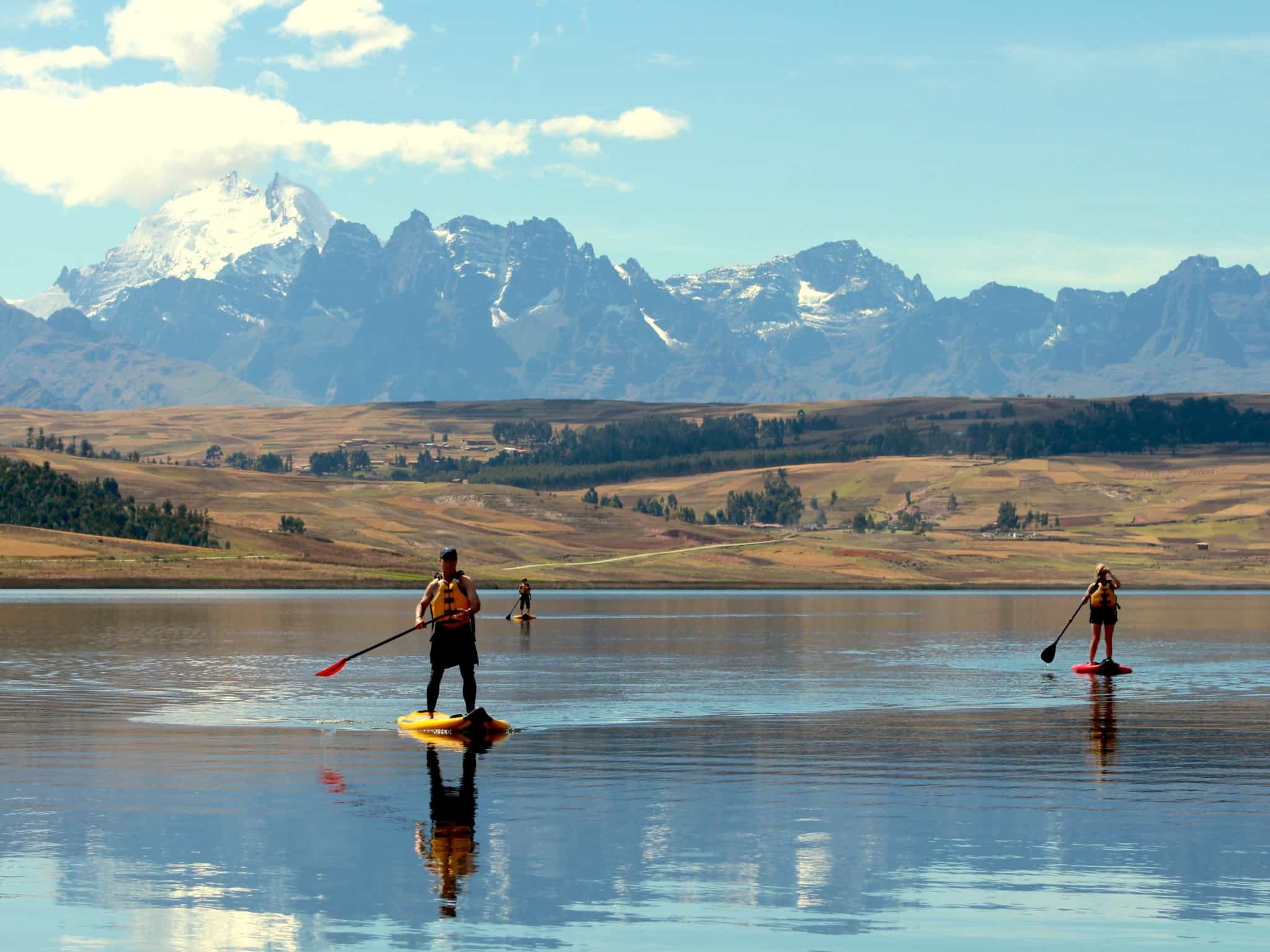 Stand up paddleboarding on Lake Huaypo in Peru. 