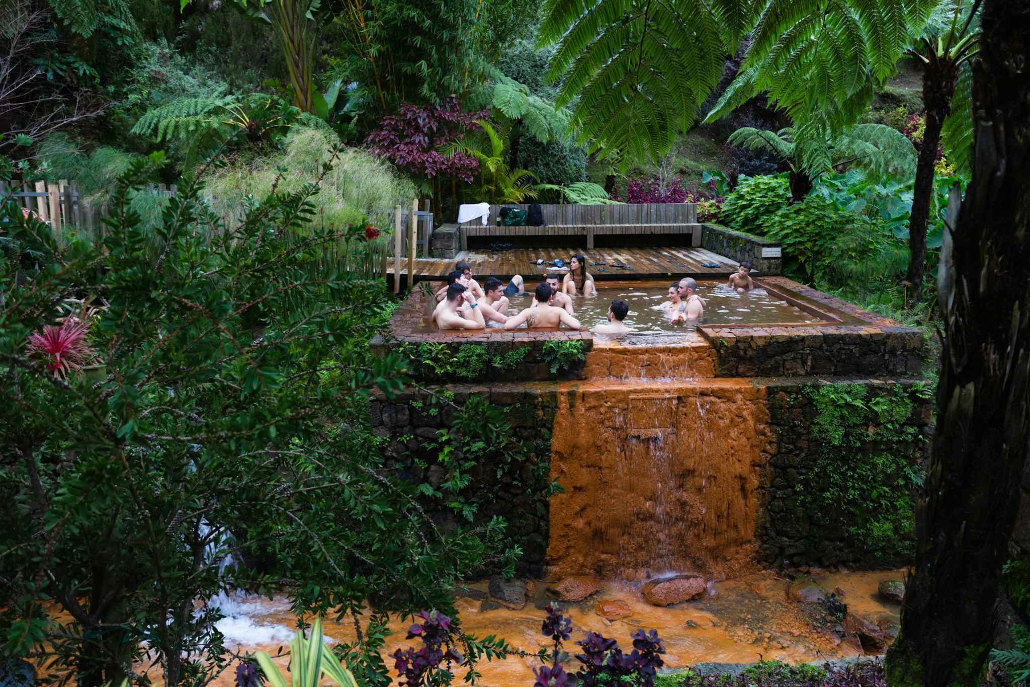 Tourists soaking in the thermal pools at Pocas da Dona Beija, Furnas, Sao Miguel, Azores