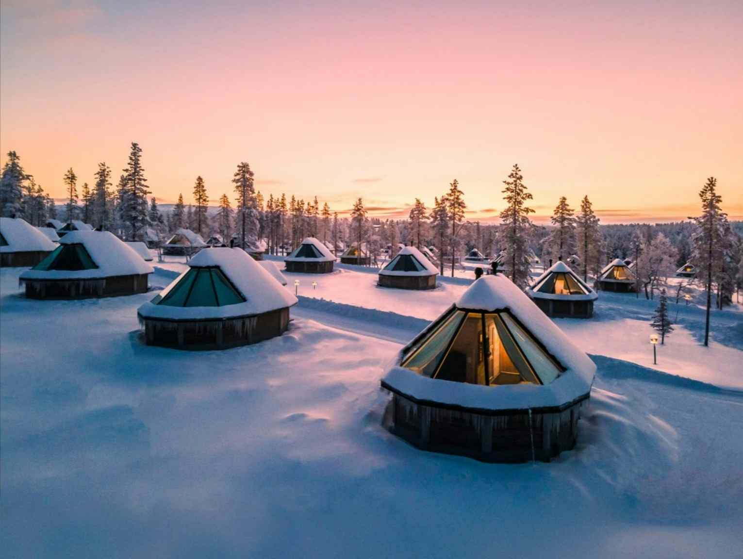Aurora cabins in Pyha, Finland at sunset.