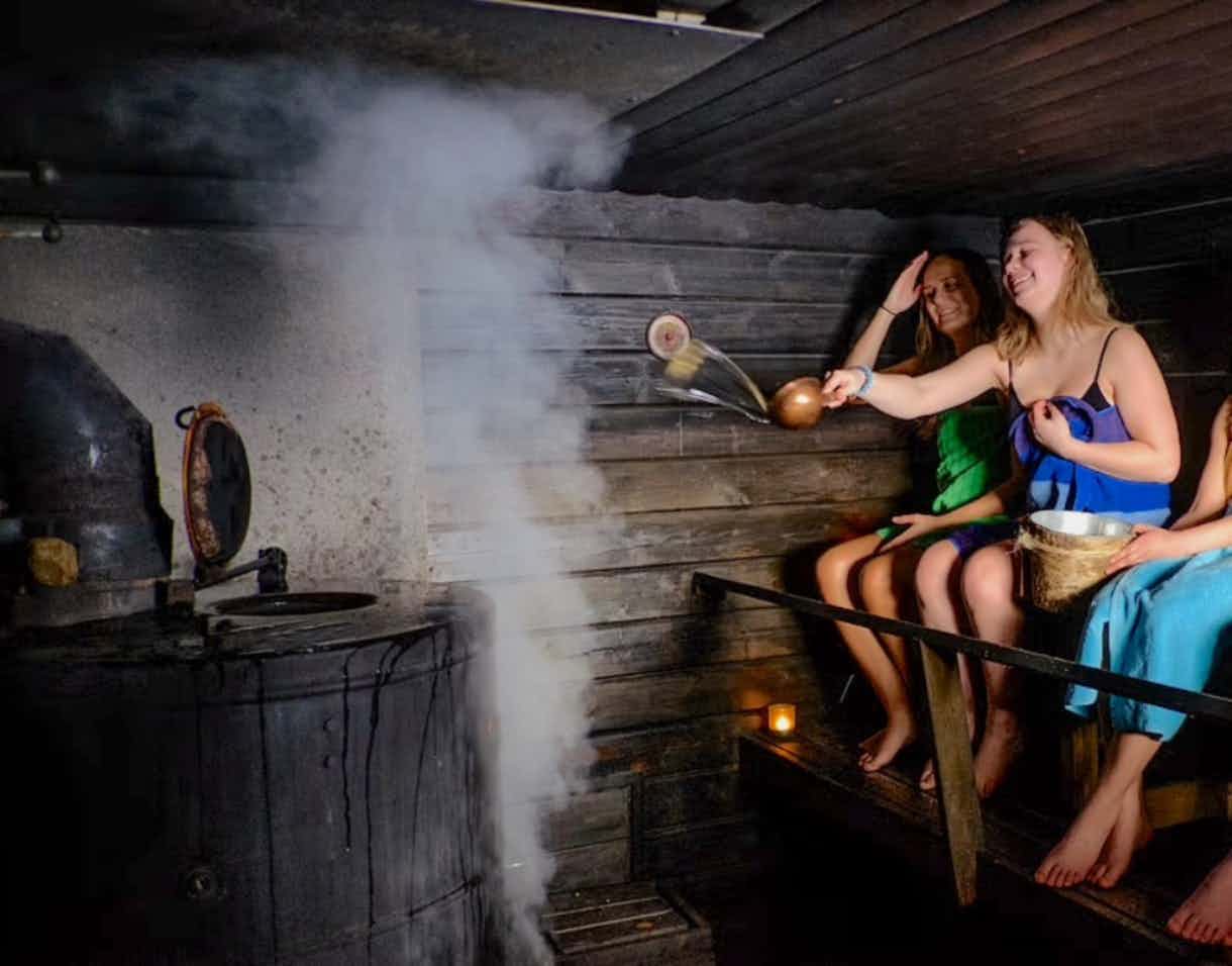 People in a traditional Finnish sauna in Lapland, Finland