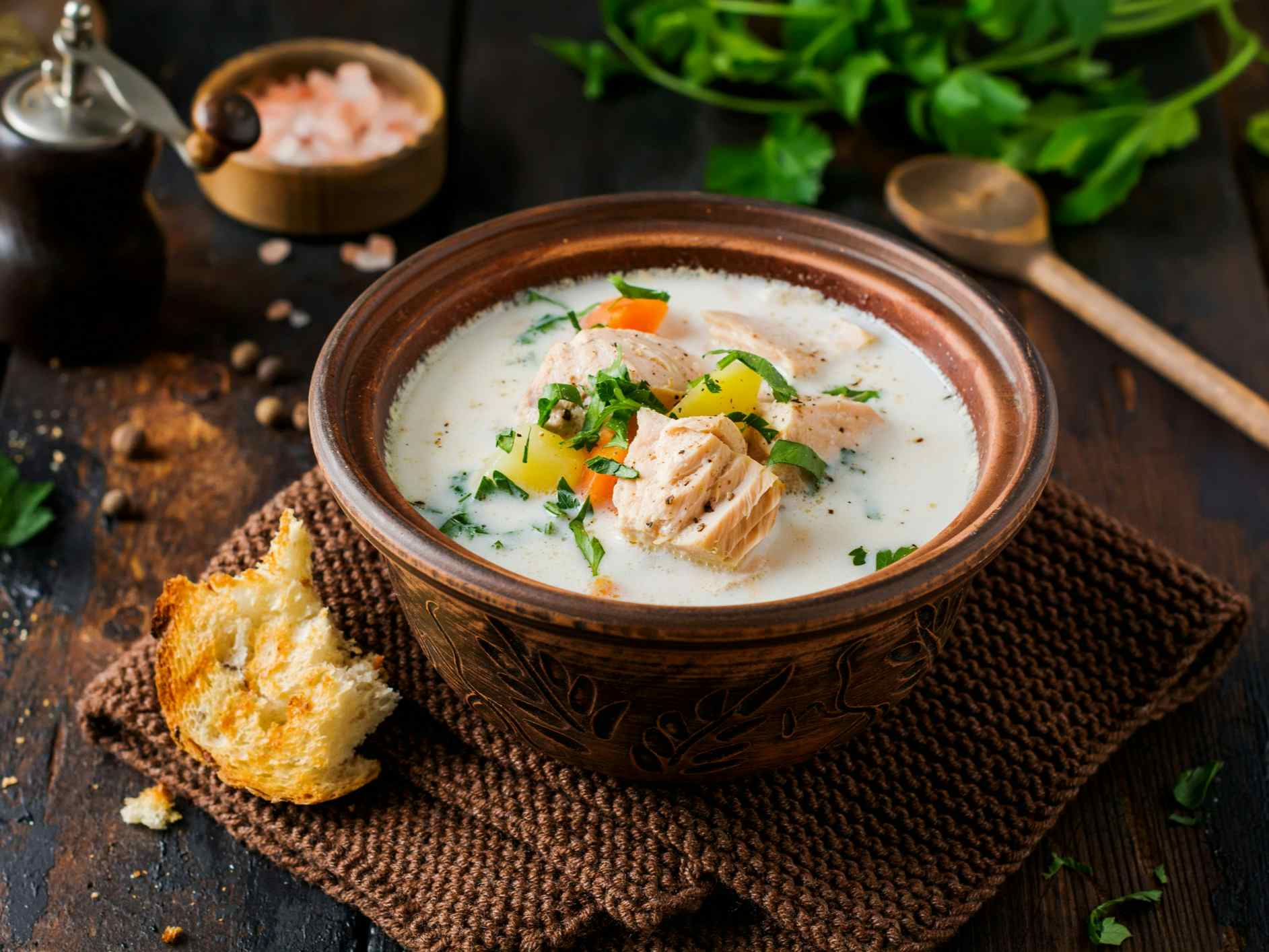 Warm Finnish creamy soup with salmon and vegetables.