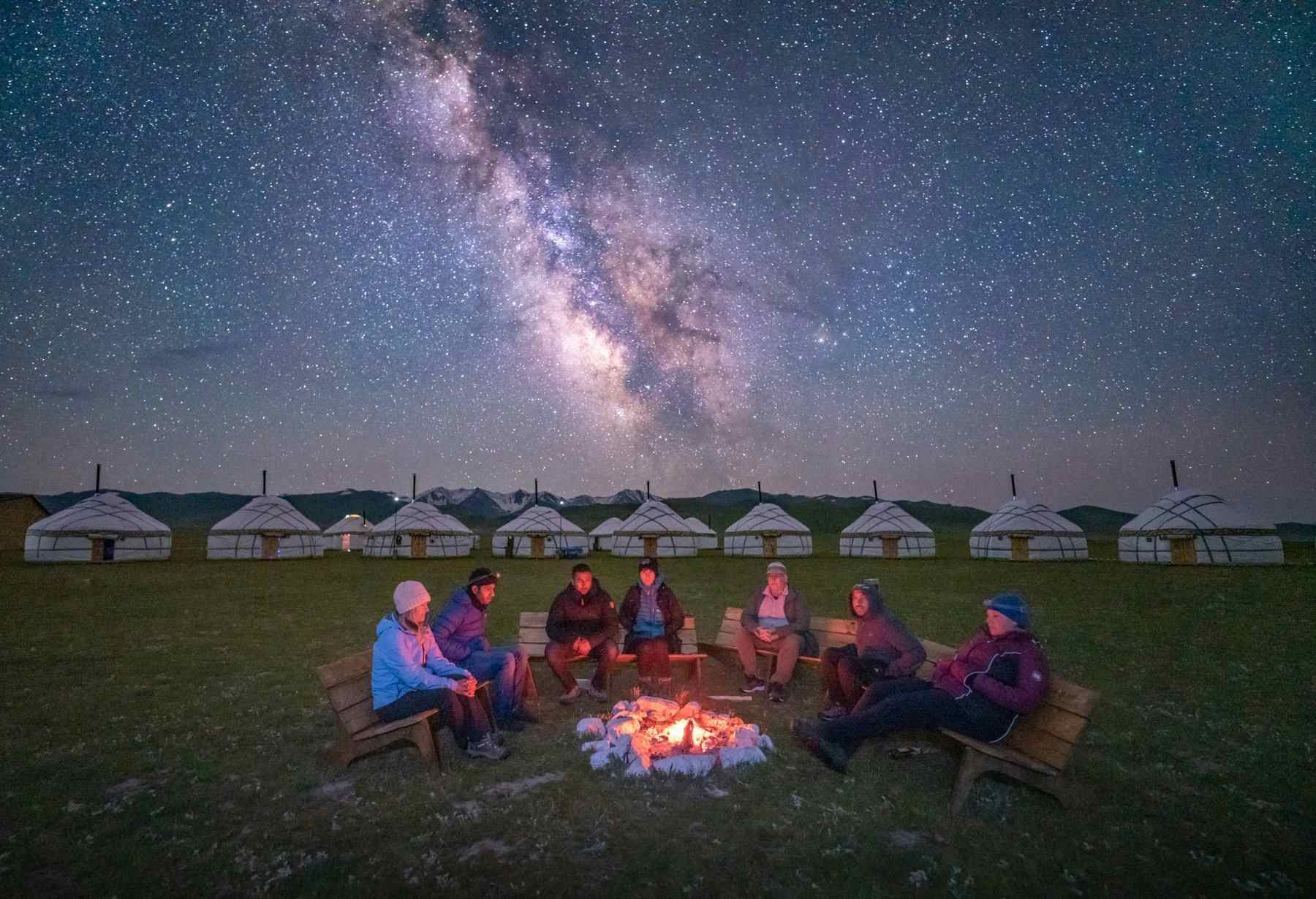 Stargazing and bonfire at night at the Nomad's Dream yurt camp, Kyrgyzstan