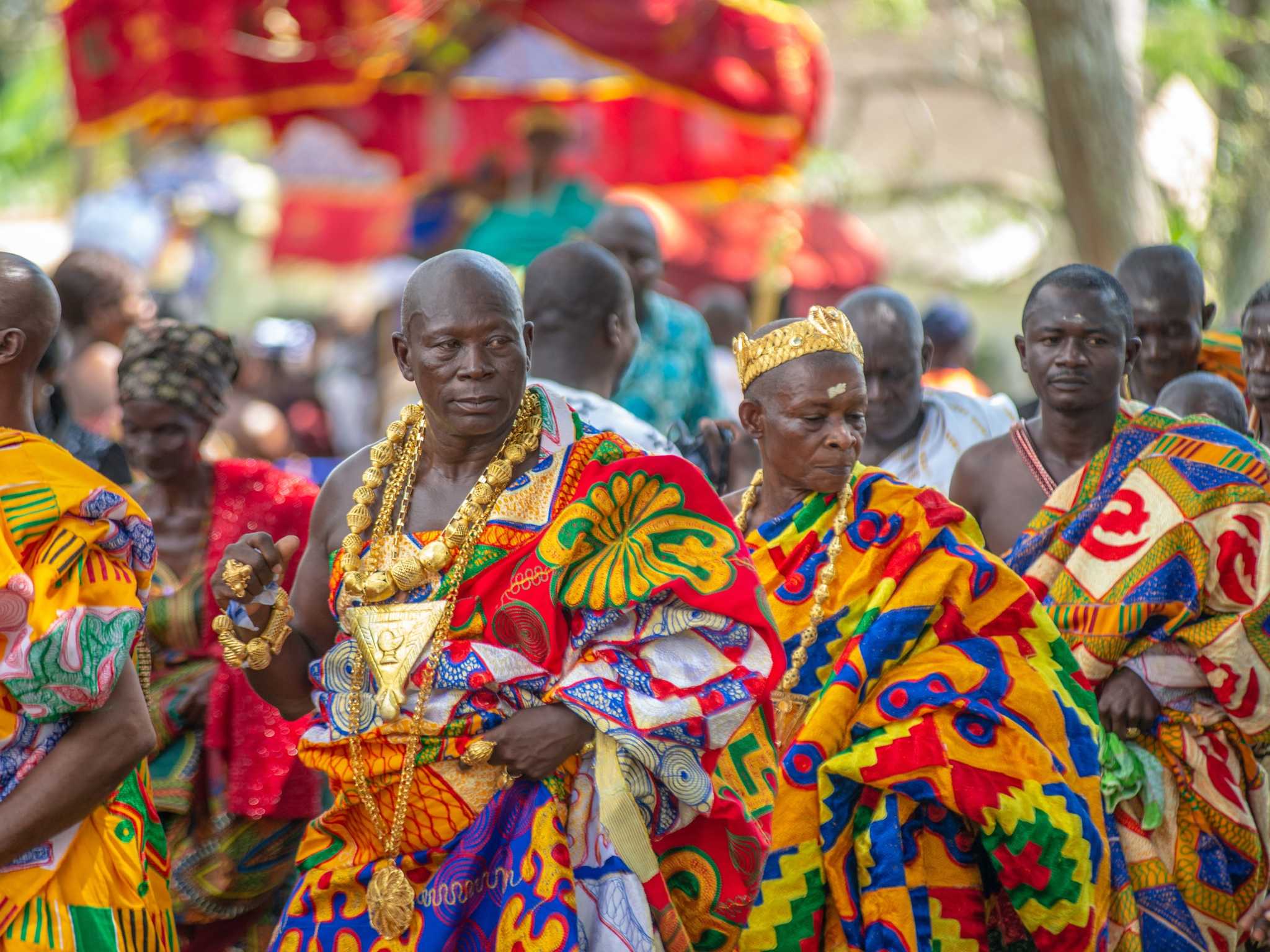 People wearing colourful kante clothes at a Ghanaian Festival