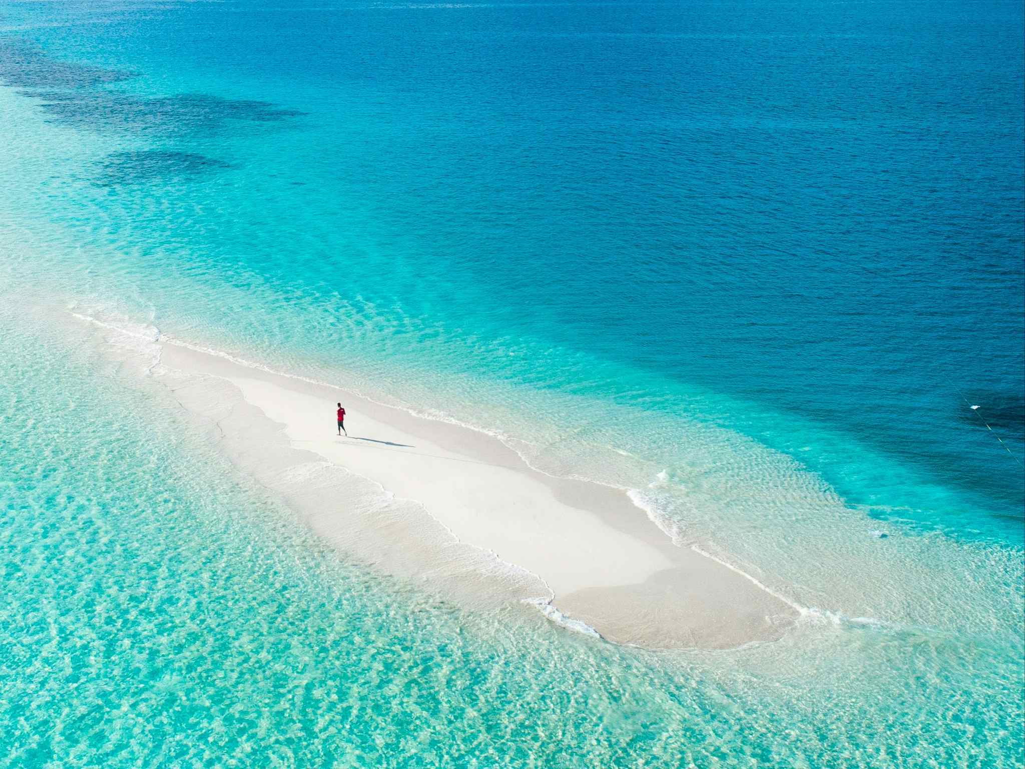 Sandbank and turquoise water in the Maldives.