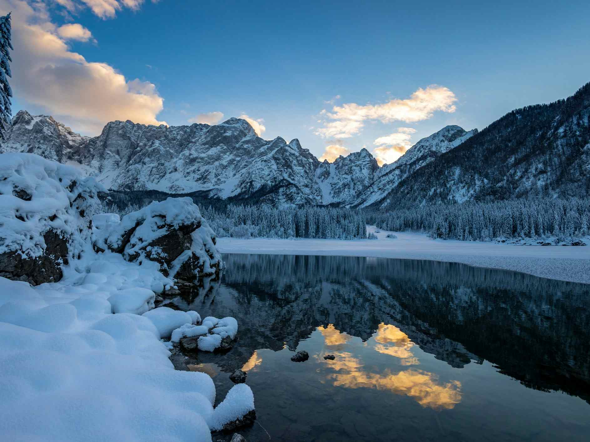 Blue skies and snowy landscapes by Fusine Lake.