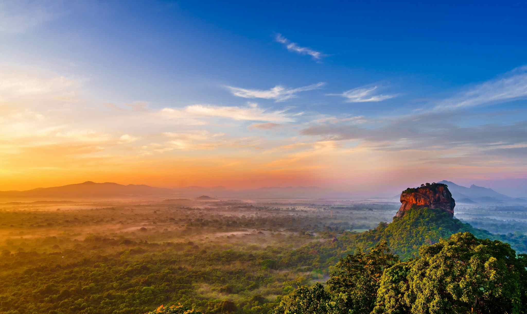 Sunrise view to Sigiriya (Lion Rock) from Pidurangala Rock in Sri Lanka.
