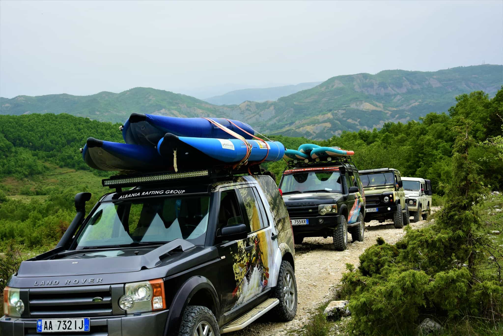 4WDs carrying kayaks going off-road in Albania