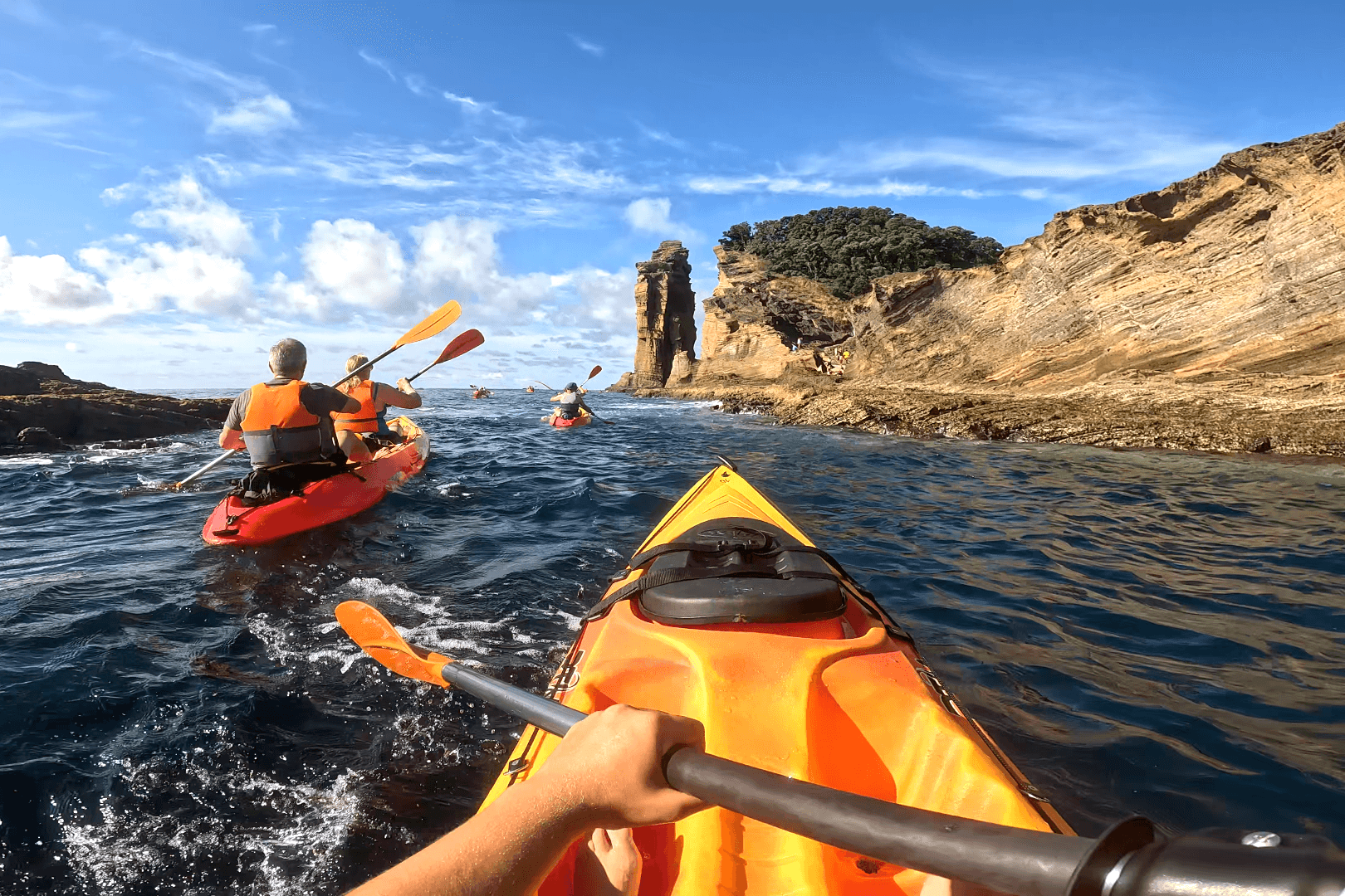 POV of a group of kayakers circumnavigating Islet Villa Franco in the Azores