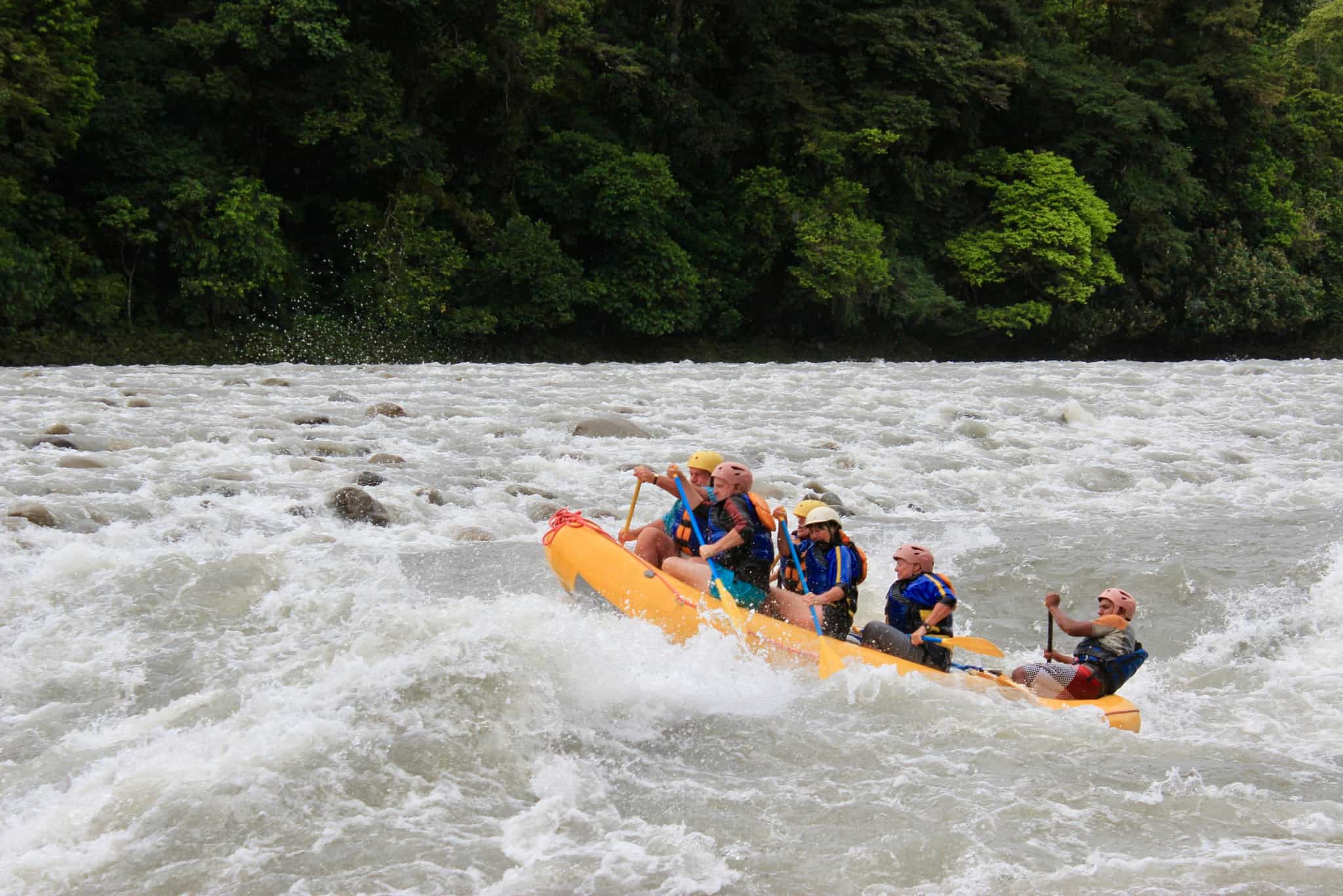 Group of rafters on a river in the Amazon, Ecuador