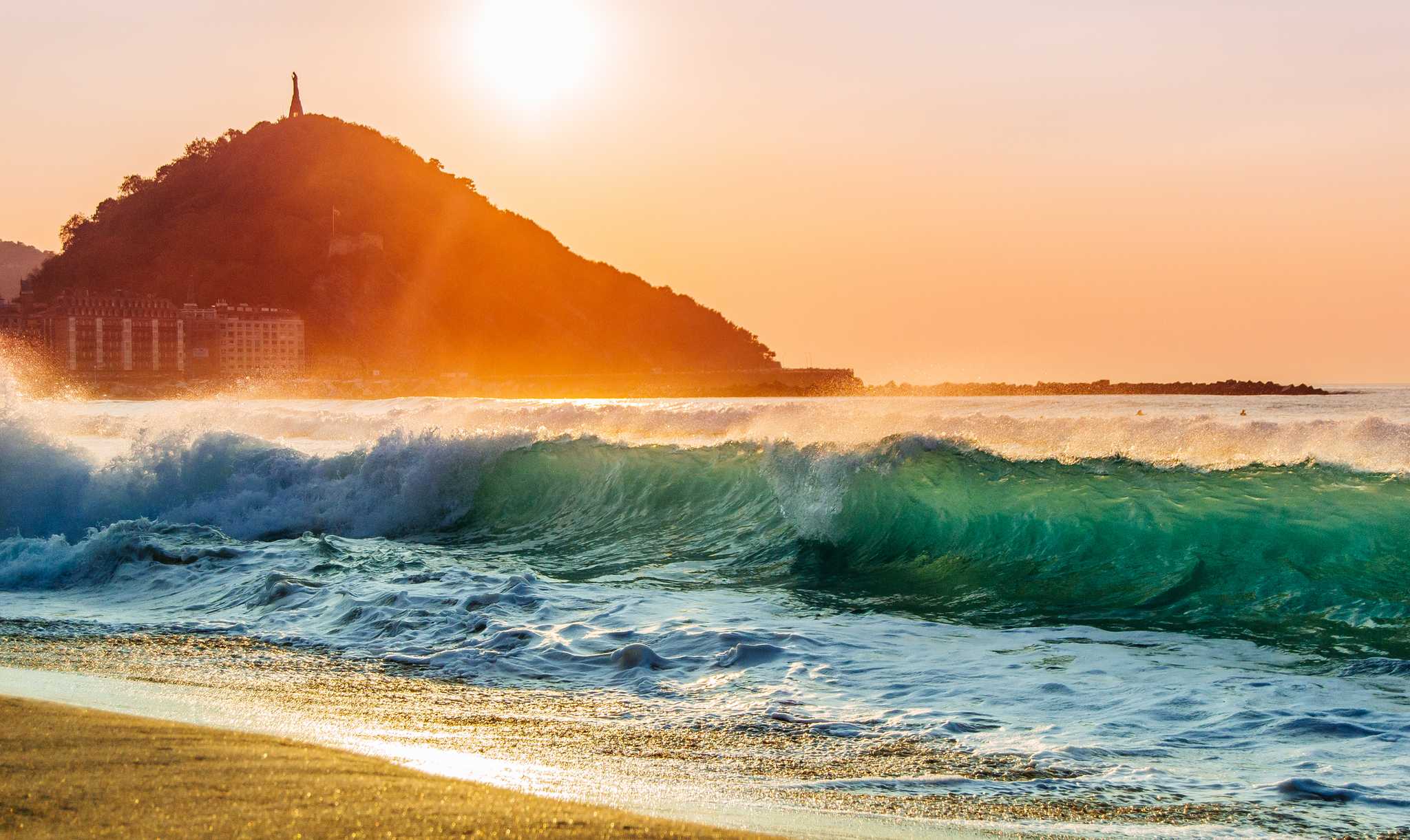 A nice shorebreak during sunset at the Zurriola beach of San Sebastian.
