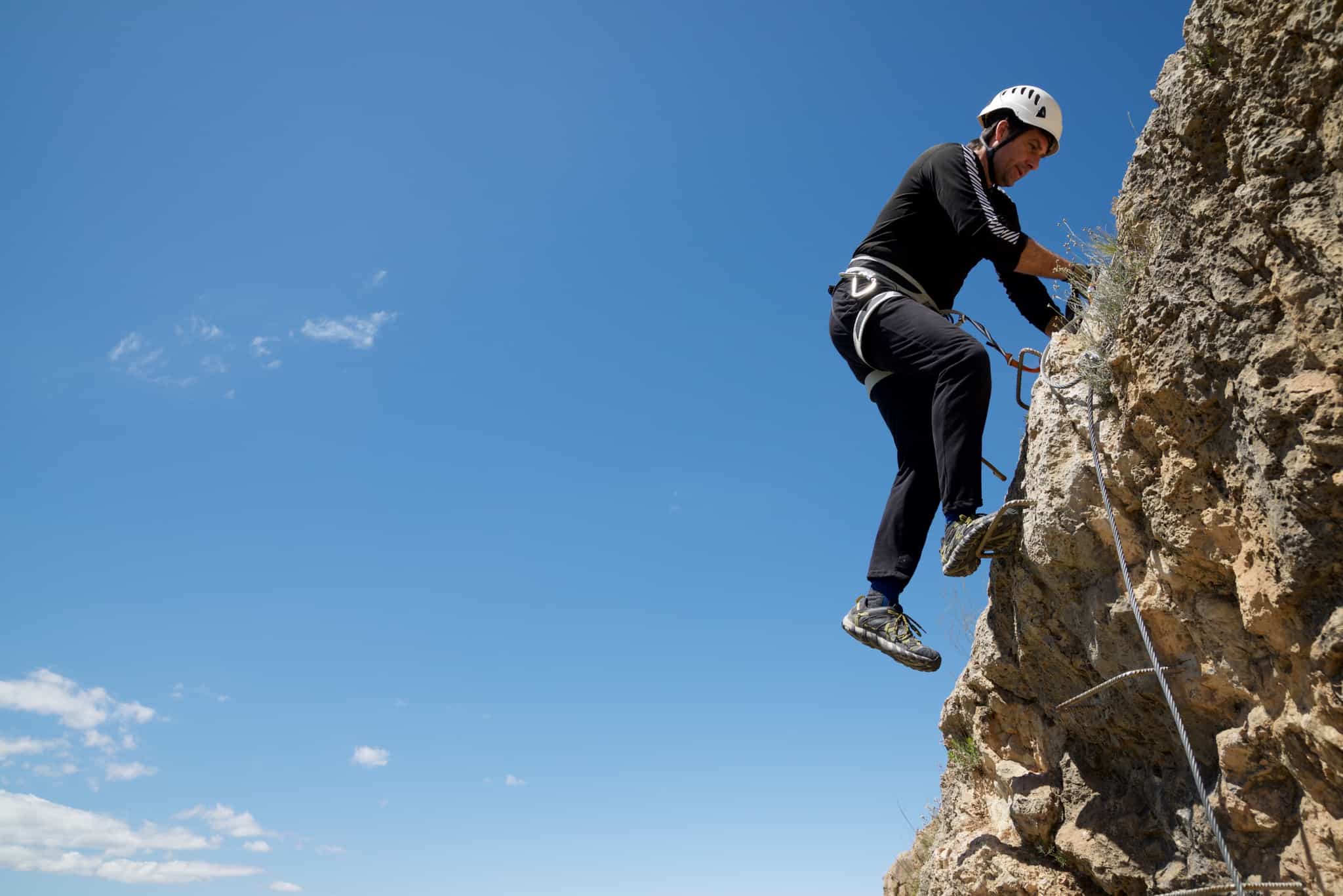 Man doing Via ferrata in Alicante province, Spain.