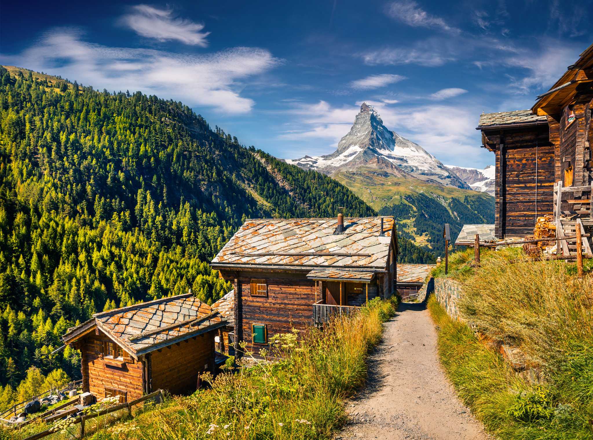 Swiss alpine hut on the edge of Zermatt with the Matterhorn behind.