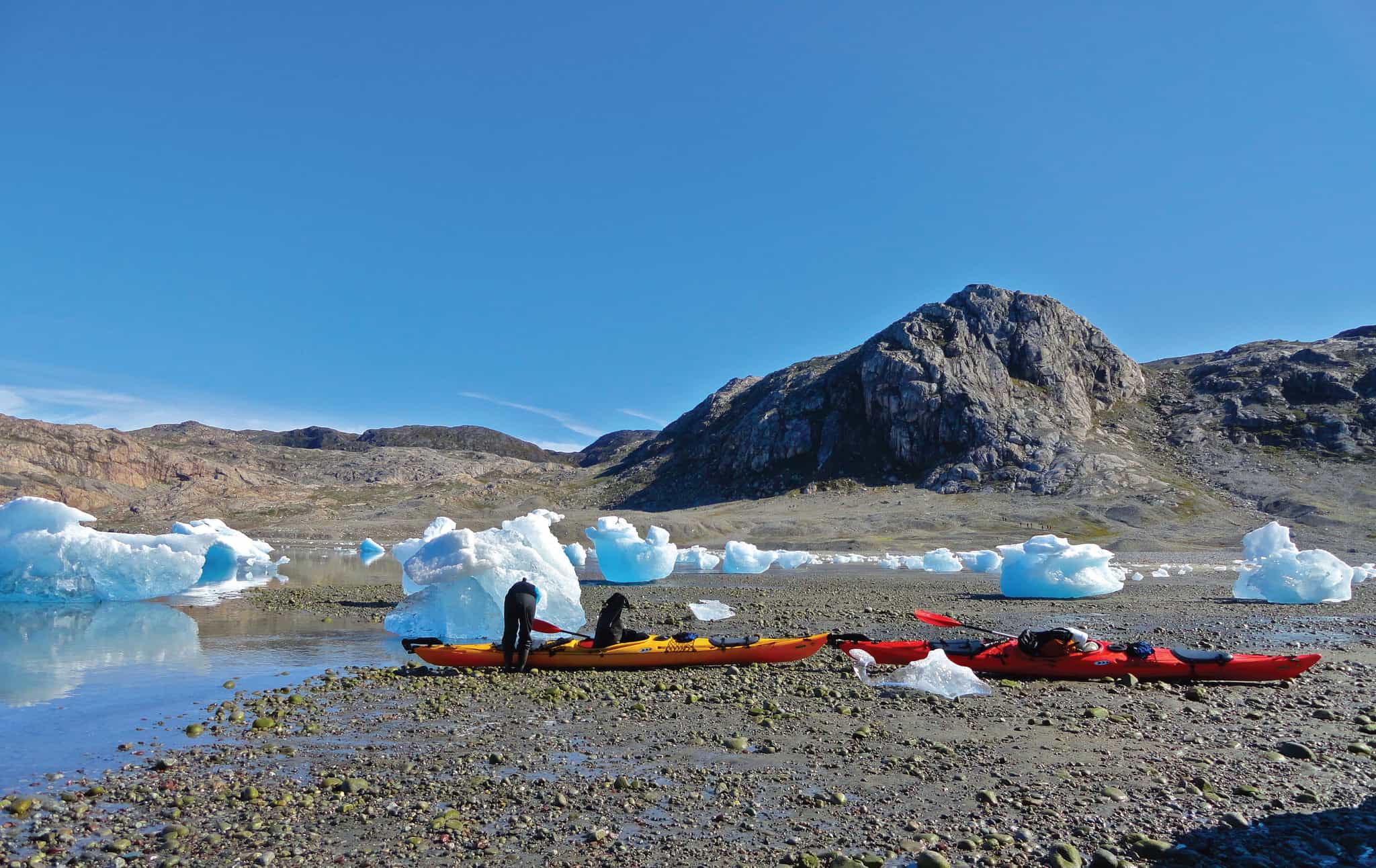 Pulling up kayaks among icebergs, Greenland