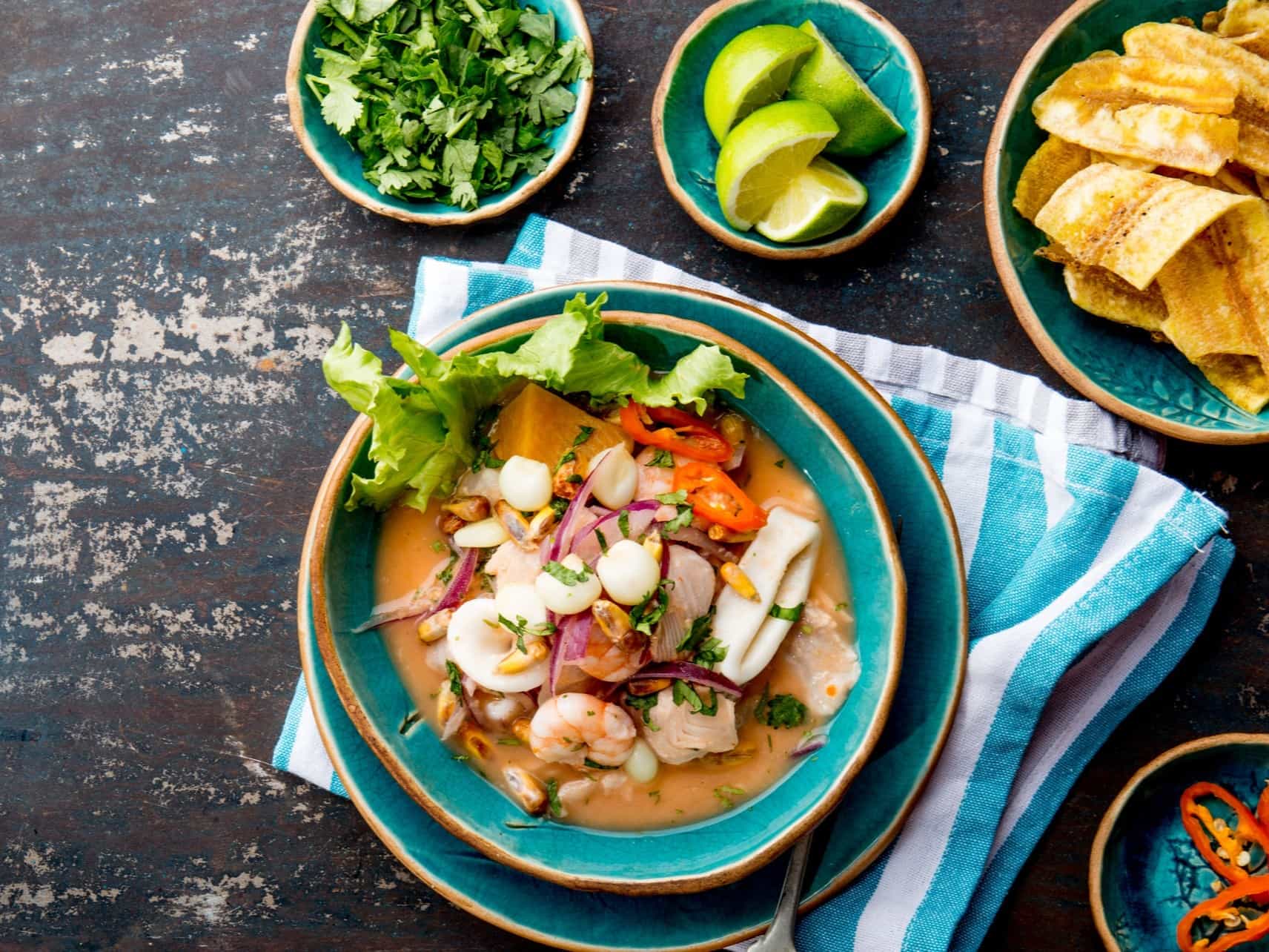 A dish of Peruvian ceviche with accompaniments.