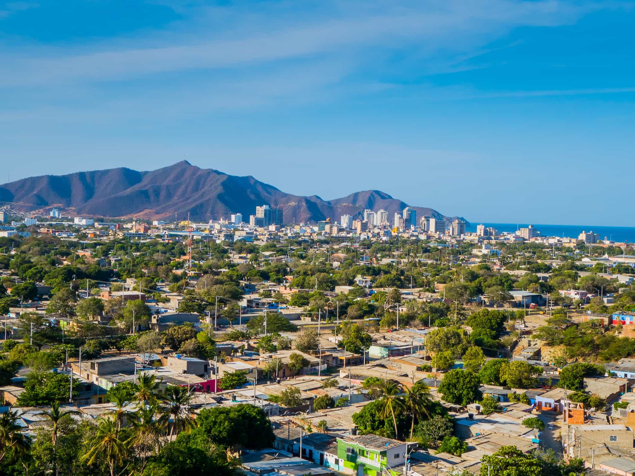 View of Santa Marta town in Colombia with the mountains and ocean in the background.