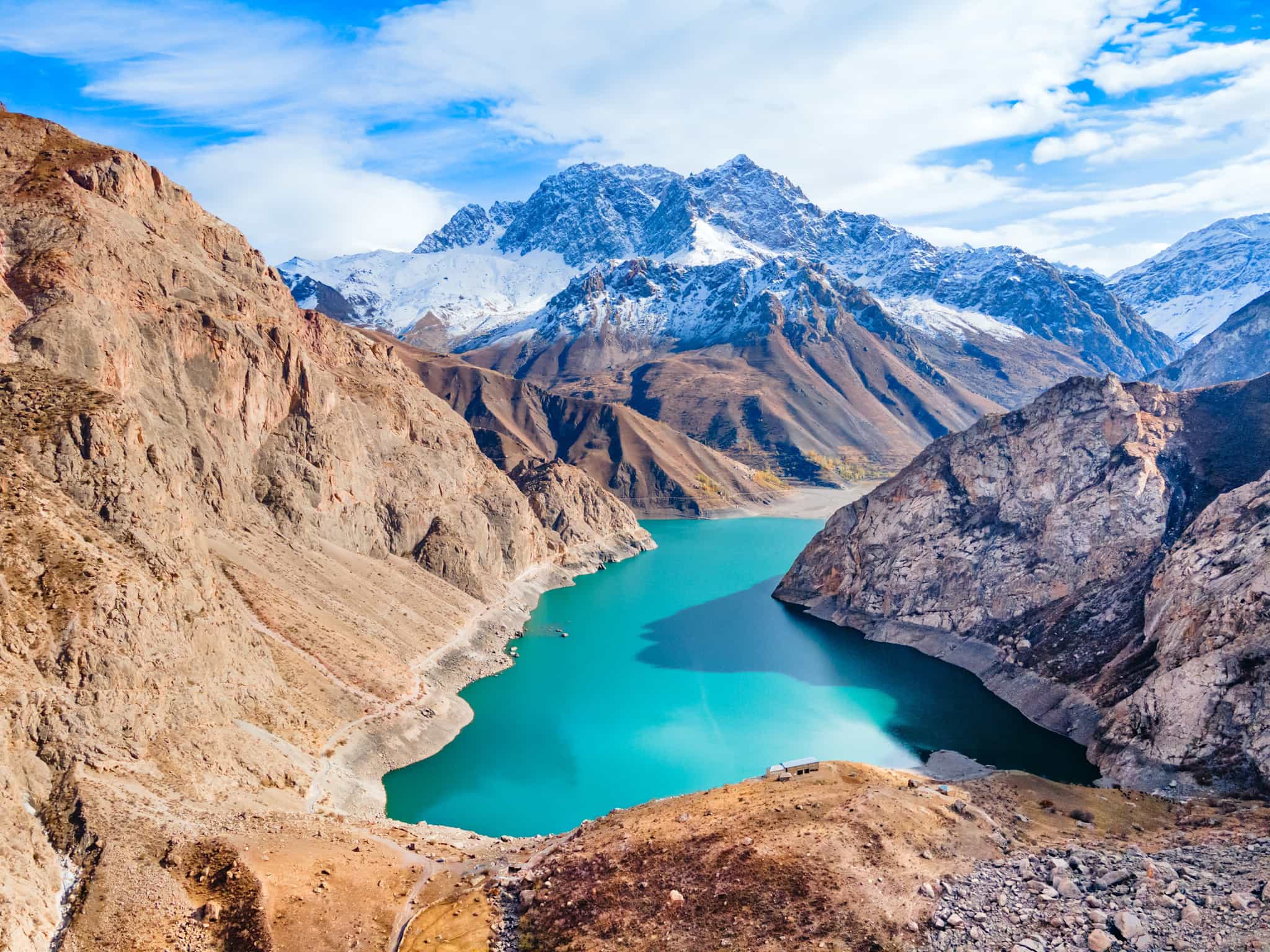 Aerial view of Marguzor lake with the high Fann Mountains in the background
