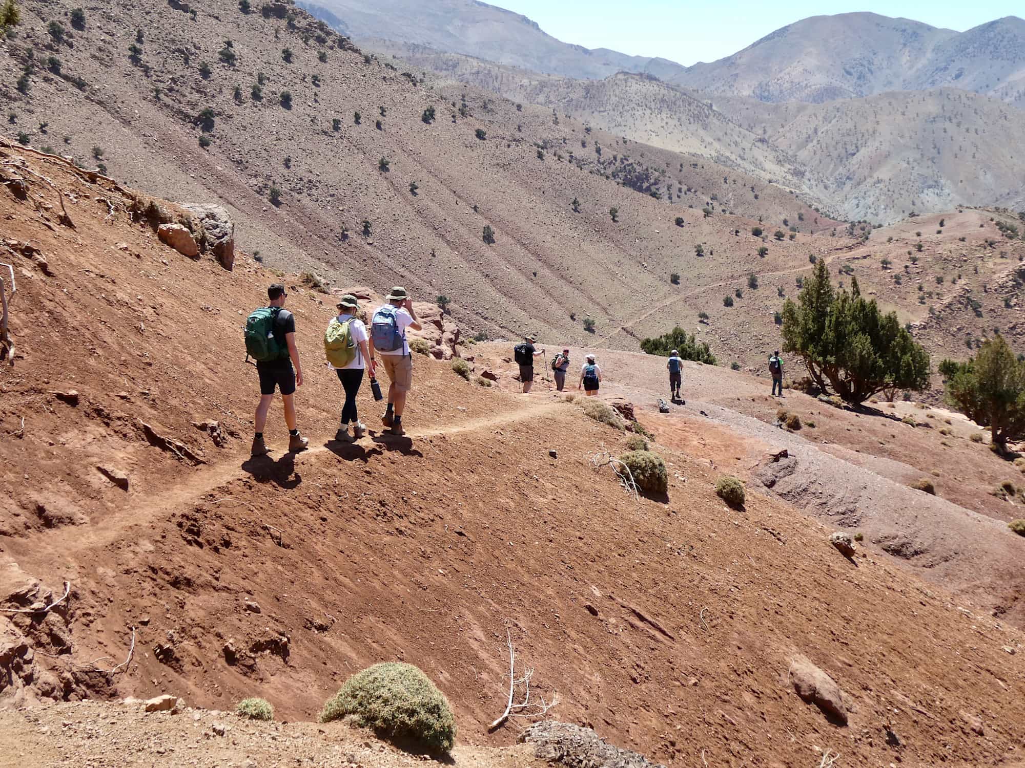 A group of people walking through the Atlas Mountains.