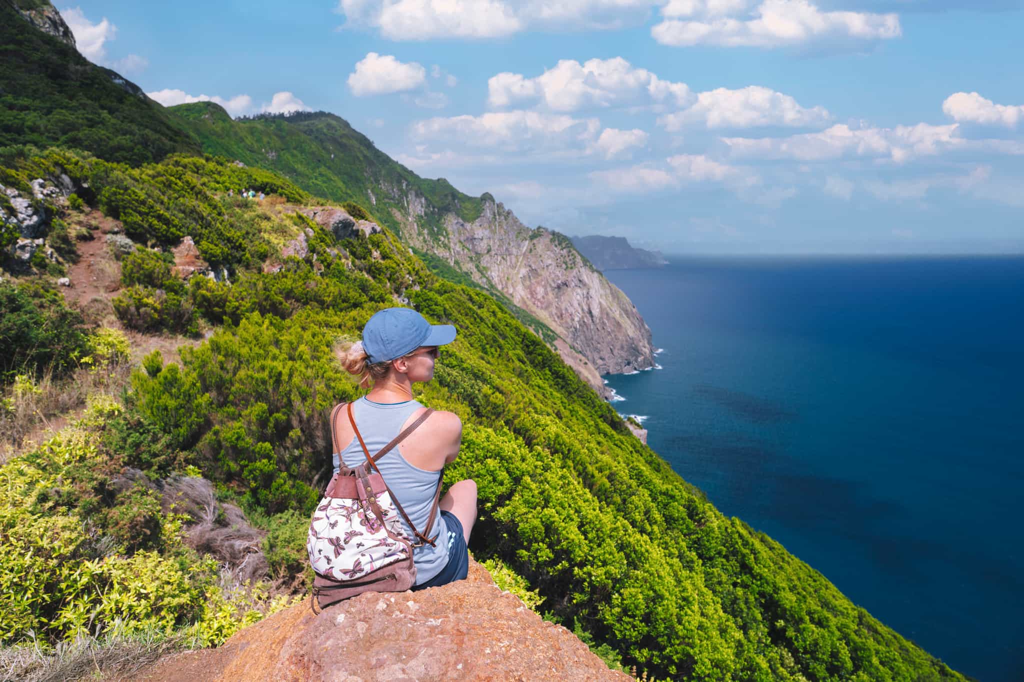 Hiker soaking in the coastal views of Madeira.