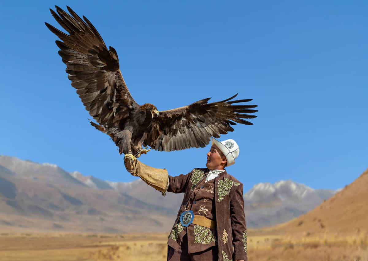 Eagle hunter in Kyrgyzstan - shutterstock 1265185363