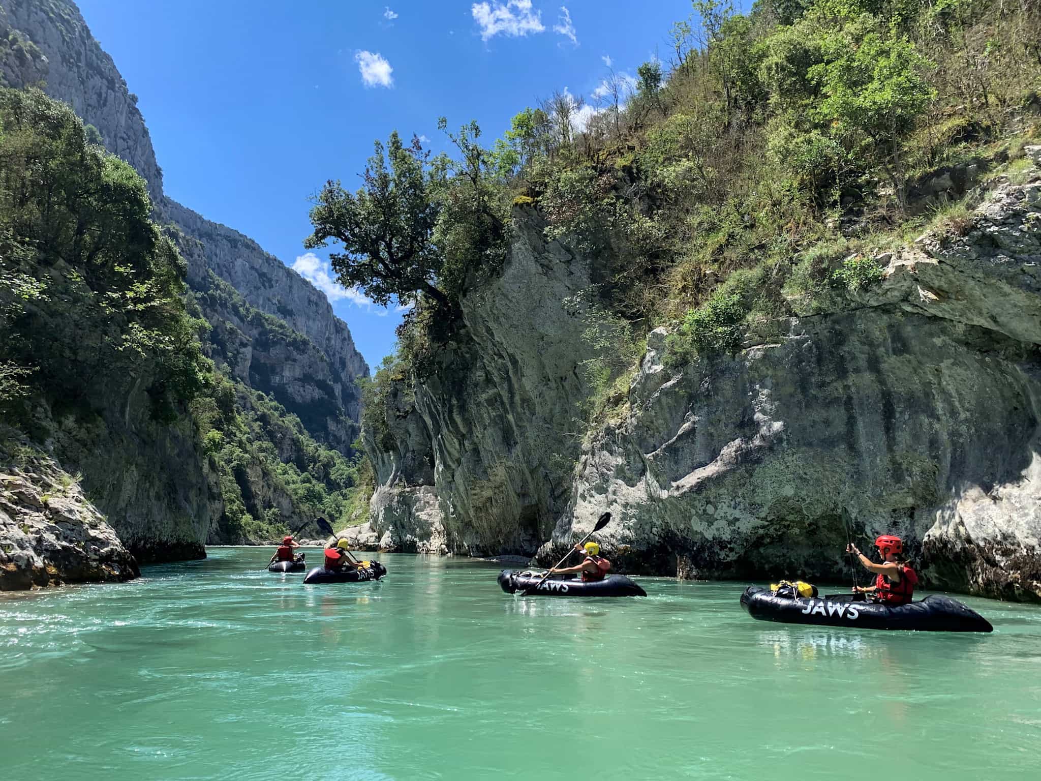 Packrafting on a turquiose river.
