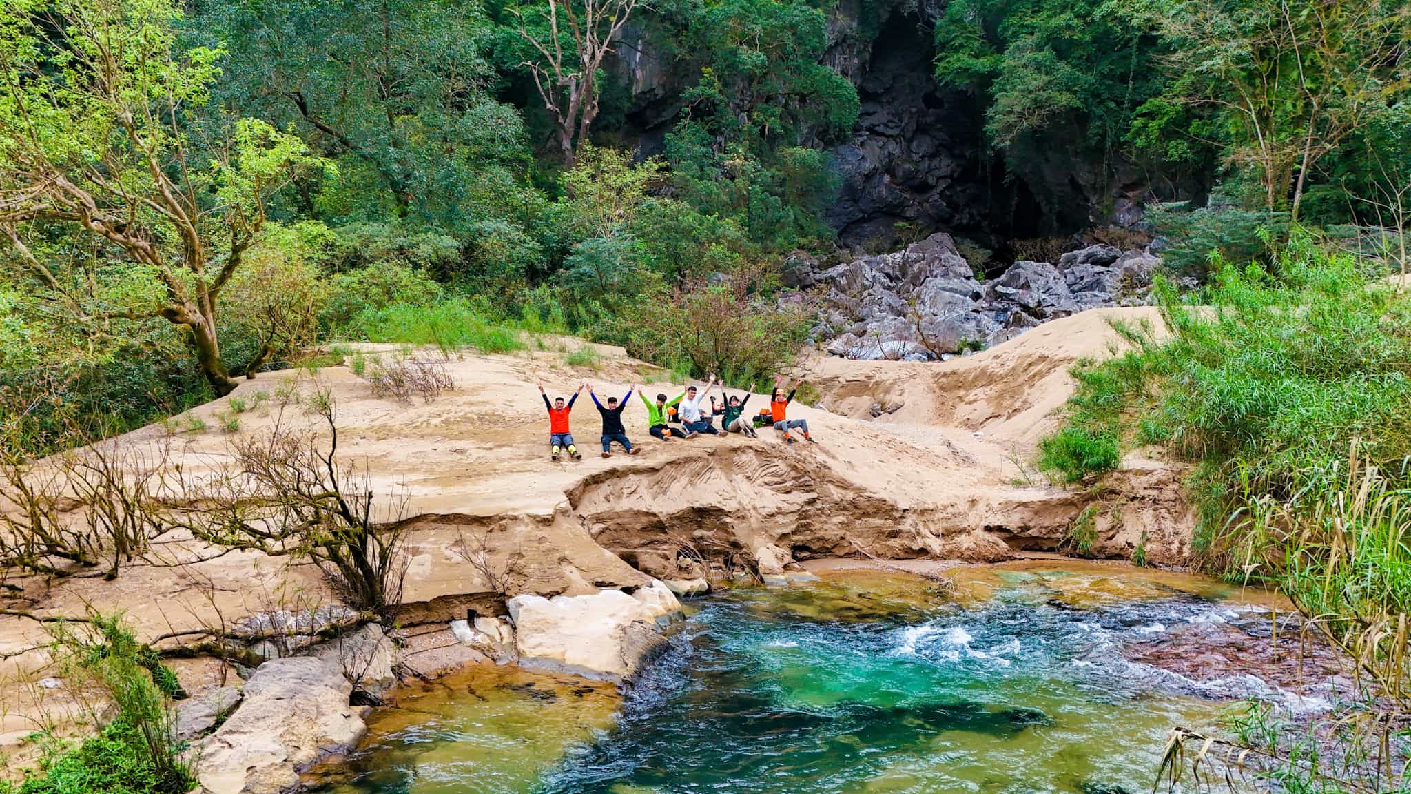 Hikers at a waterfall in Ma da Valley, Vietnam