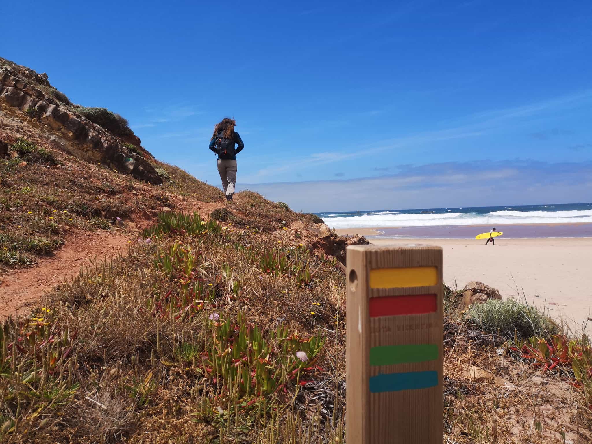 Hiker at Carrapateira Beach in Portugal.