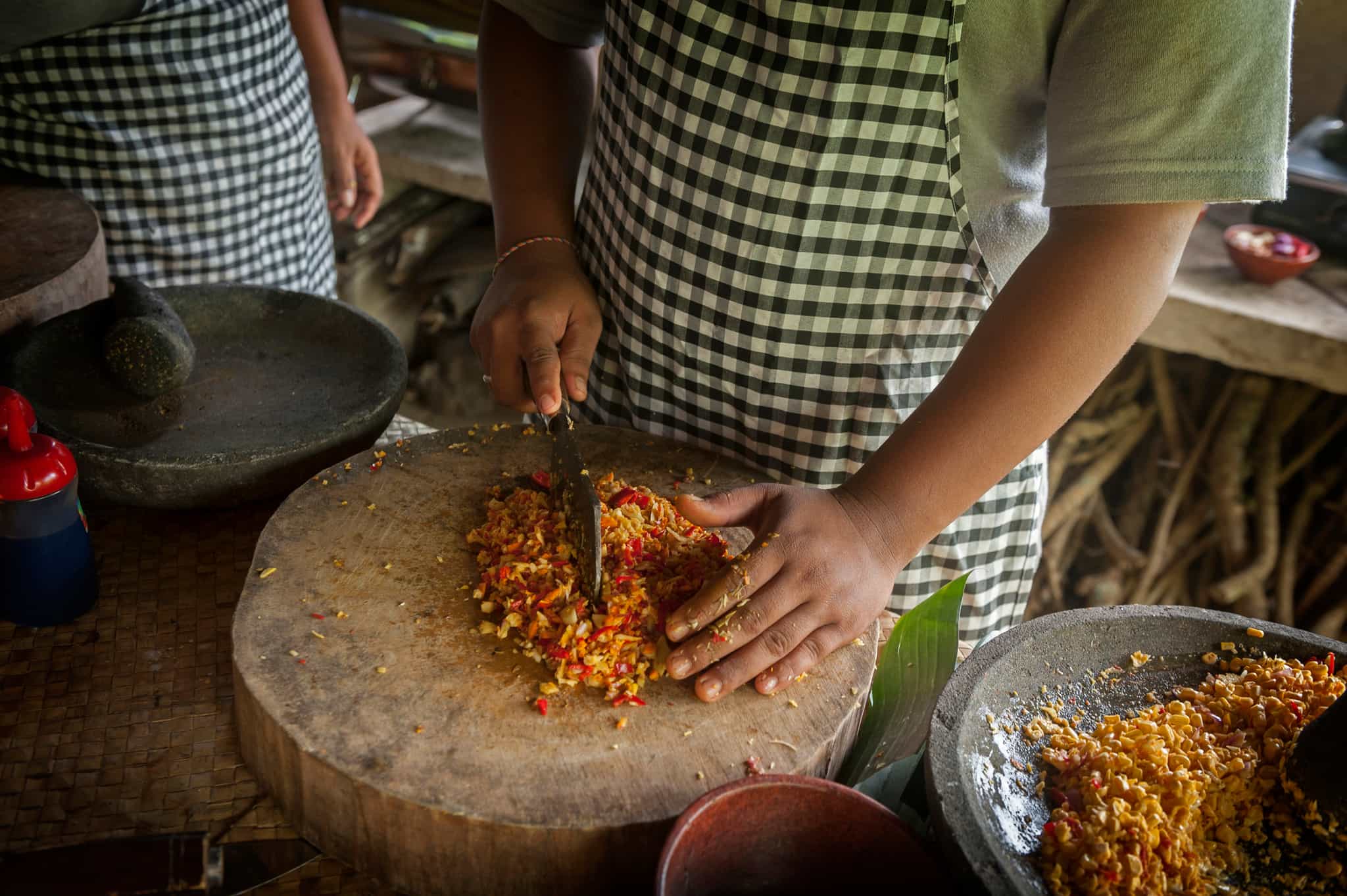Local chopping vegetables in Bali, Indonesia