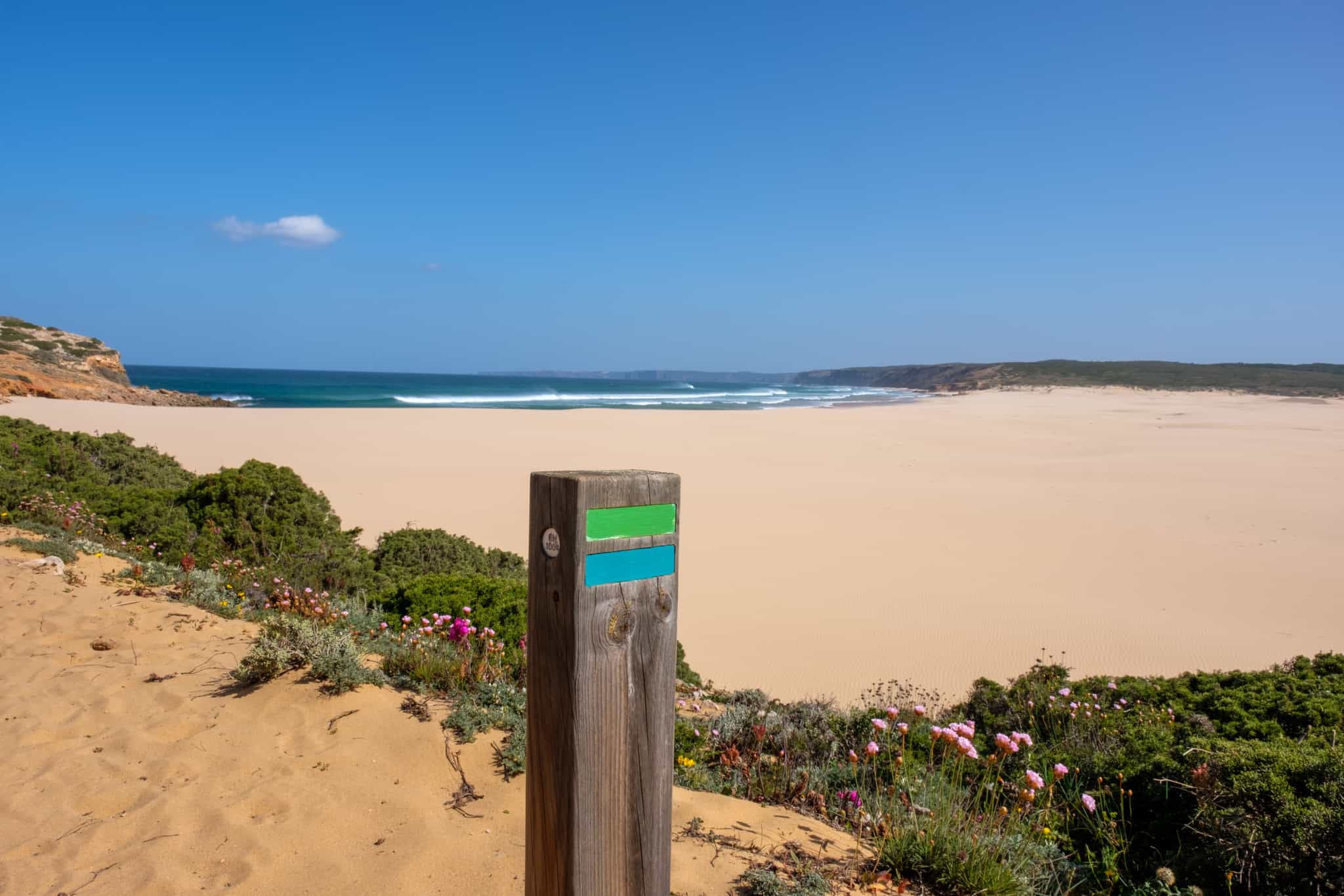 Beach and path's mark along Rota Vicentina, Portugal.