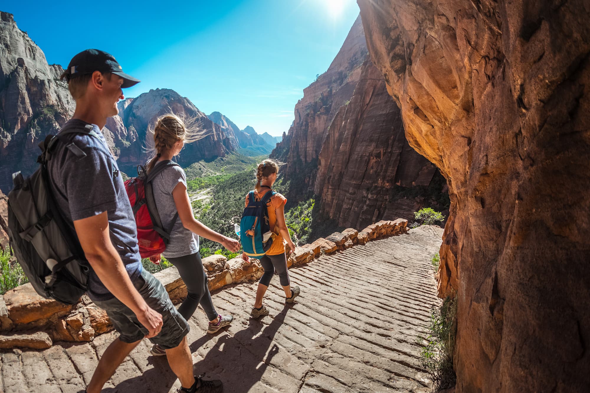 Hikers in Zion National Park on a sunny day, USA