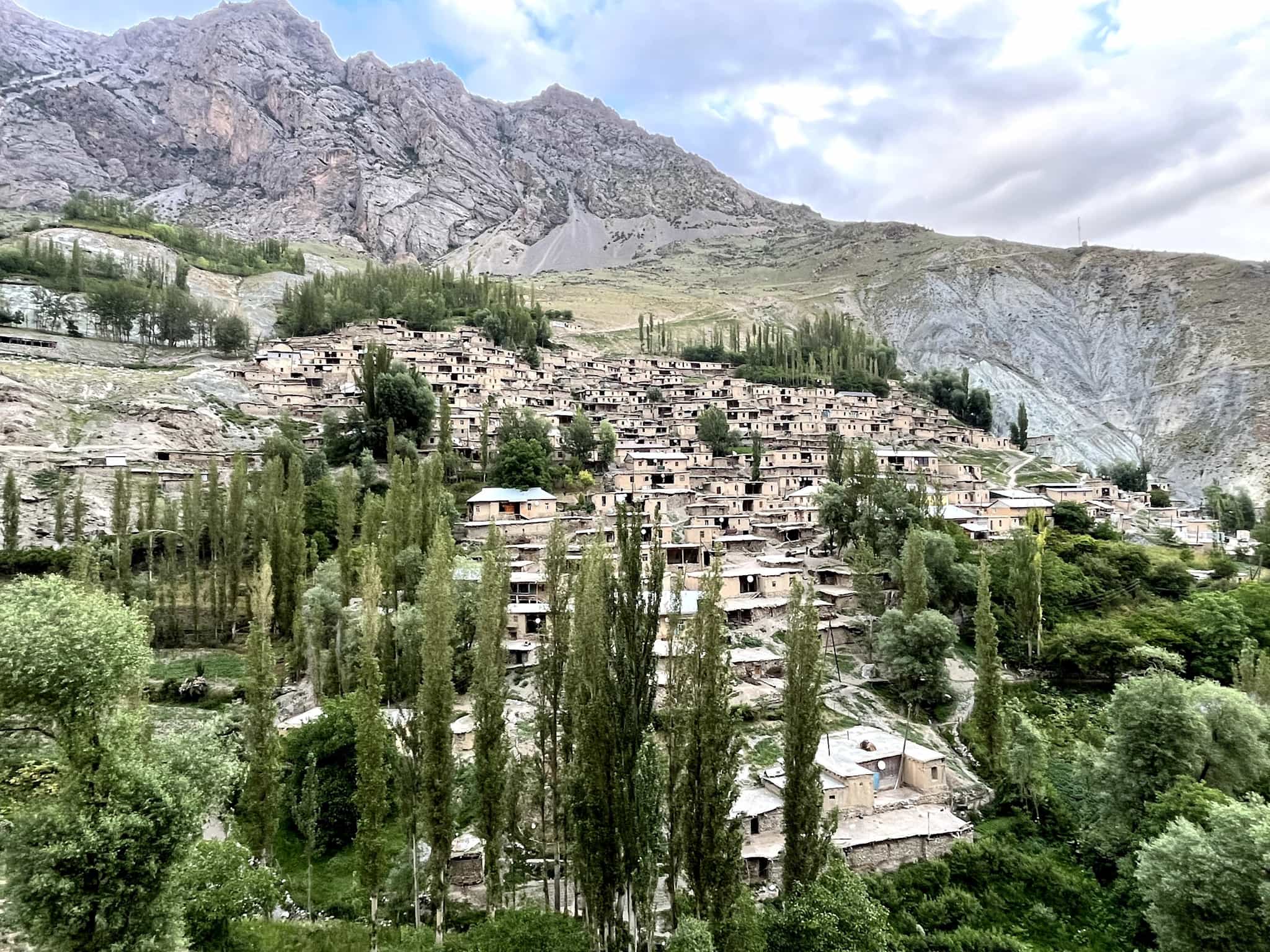 The village of Voru set into the mountainside of the Fann Mountains