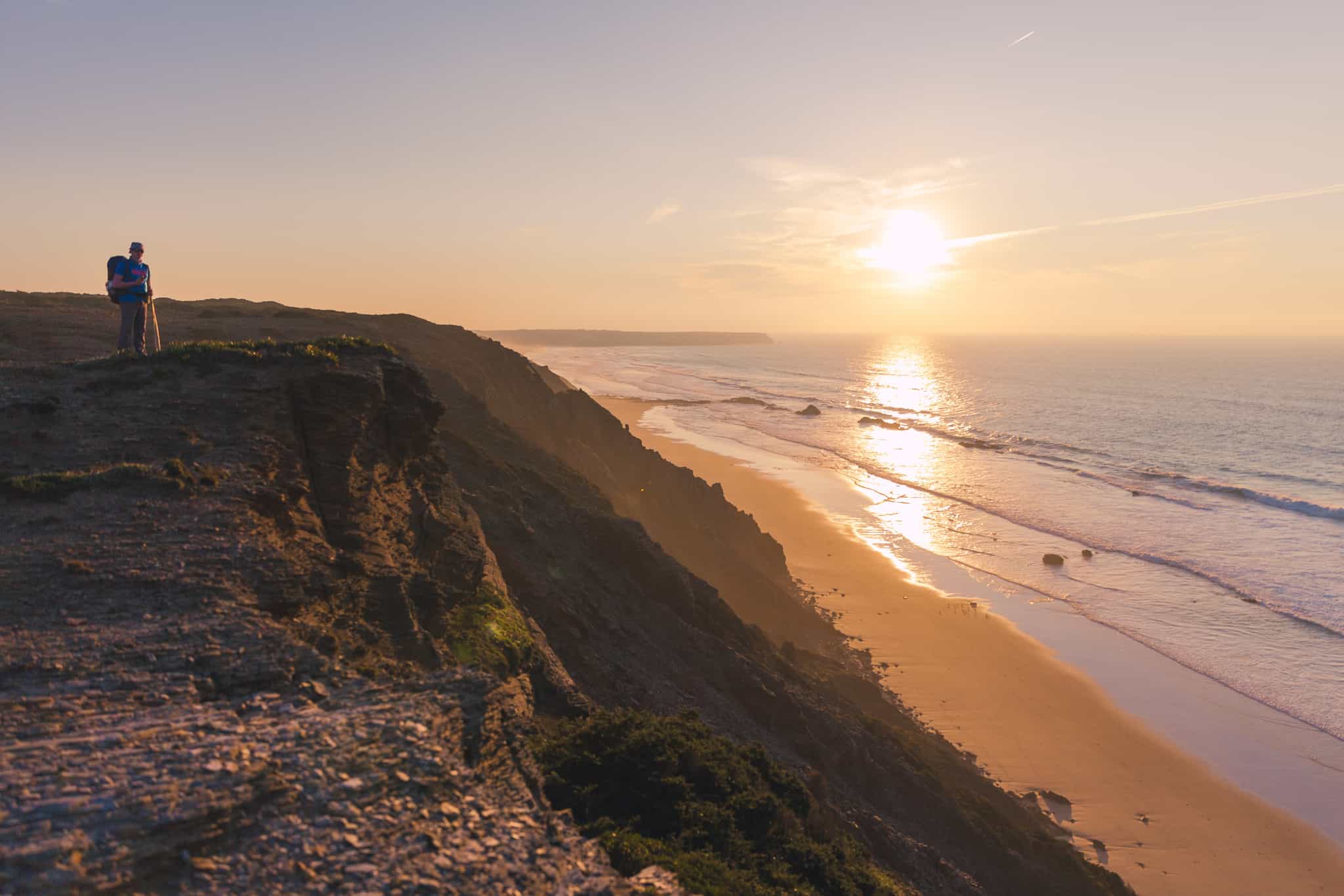 Hiker at sunset along the Rota Vicentina, Portugal