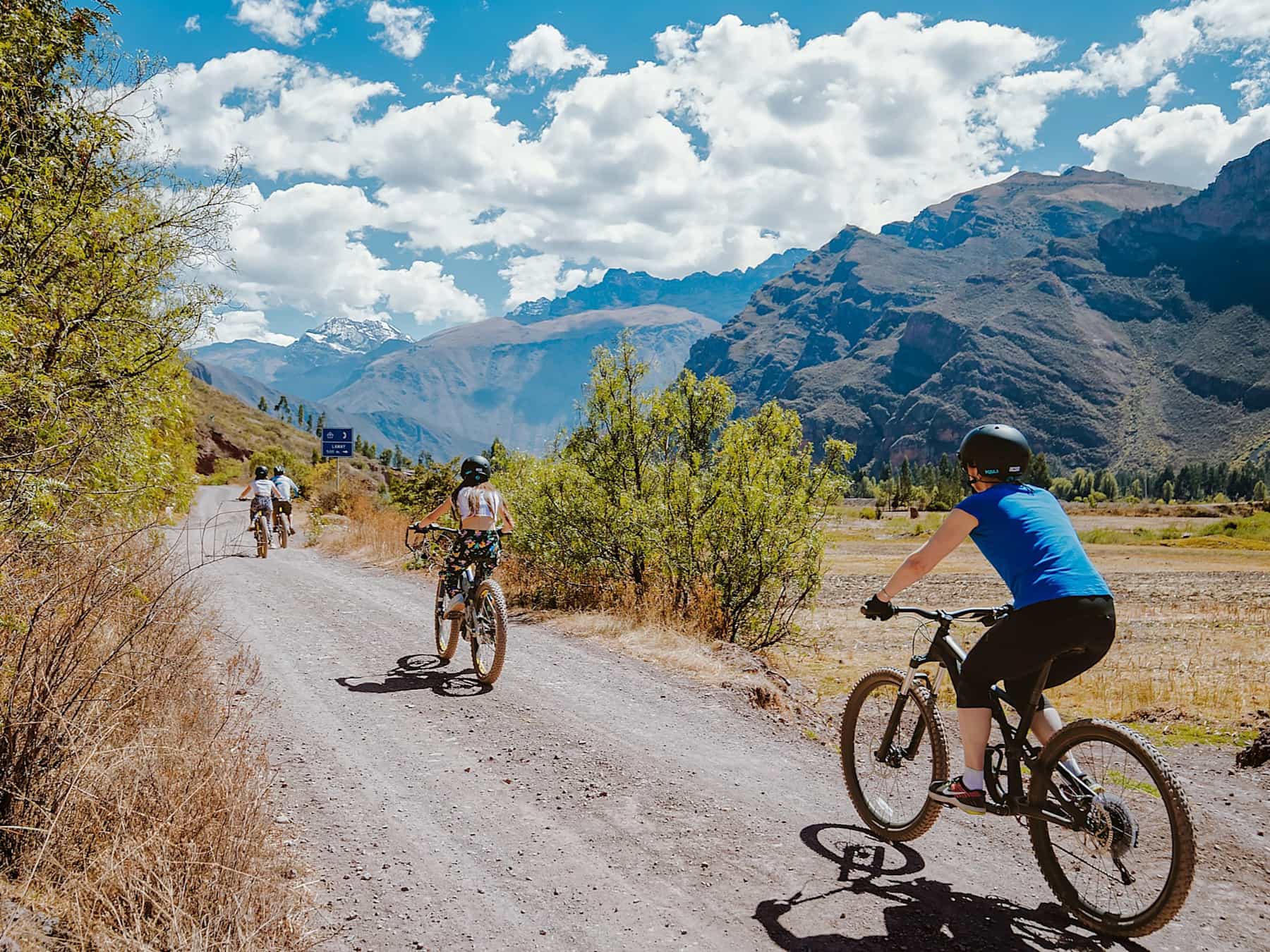 Cyclist pedalling on a gravel track in the Sacred Valley, Peru
