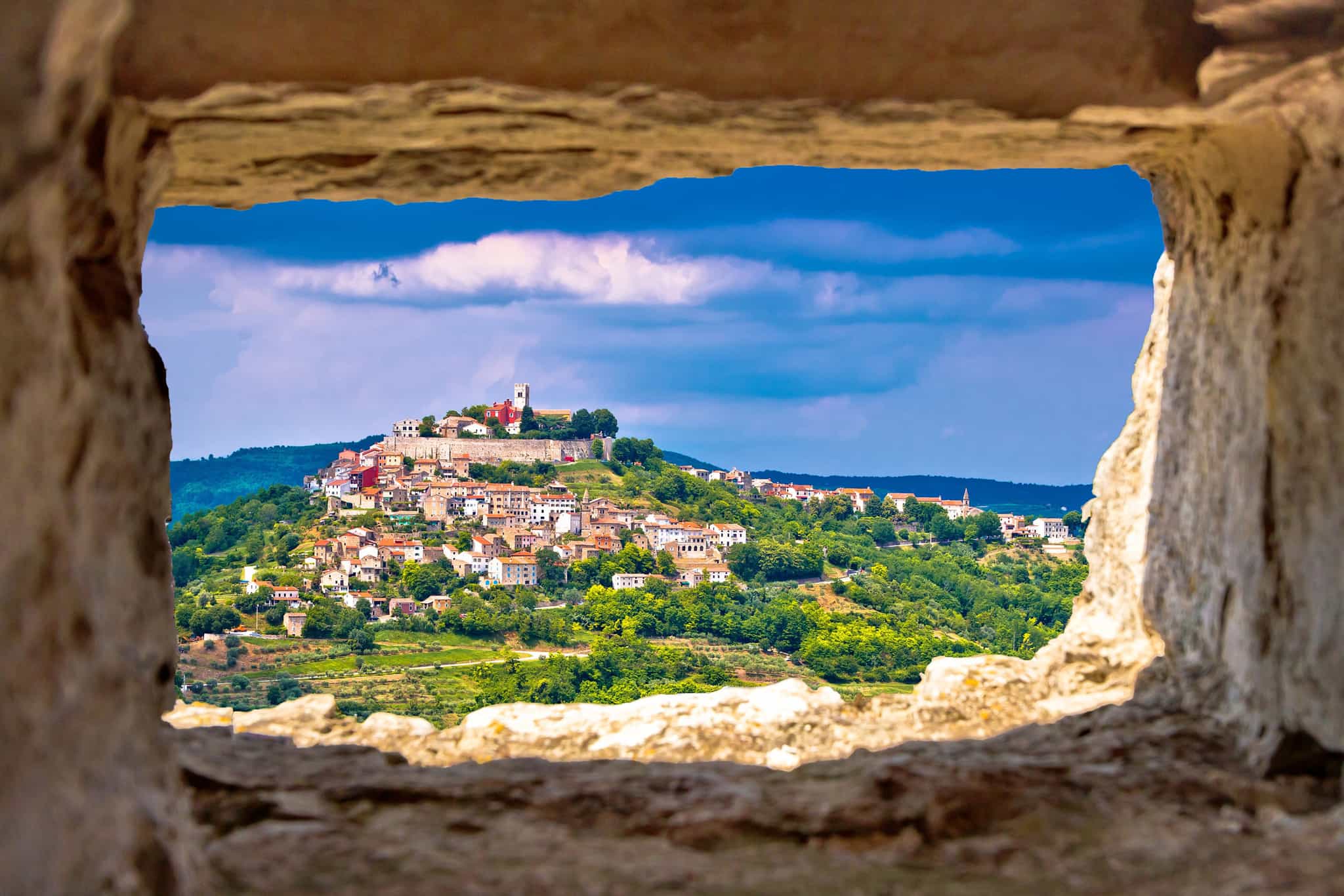 View of Motovun through a stone window