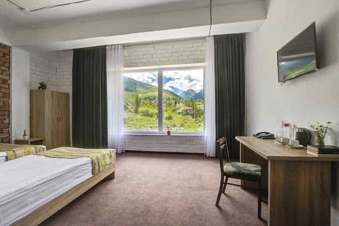 Twin hotel room with mountain view in Ala Archa National Park, Kyrgyzstan