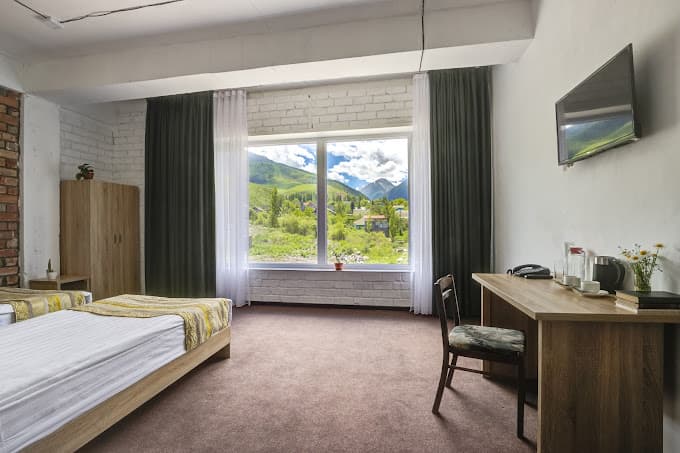 Twin hotel room with mountain view in Ala Archa National Park, Kyrgyzstan