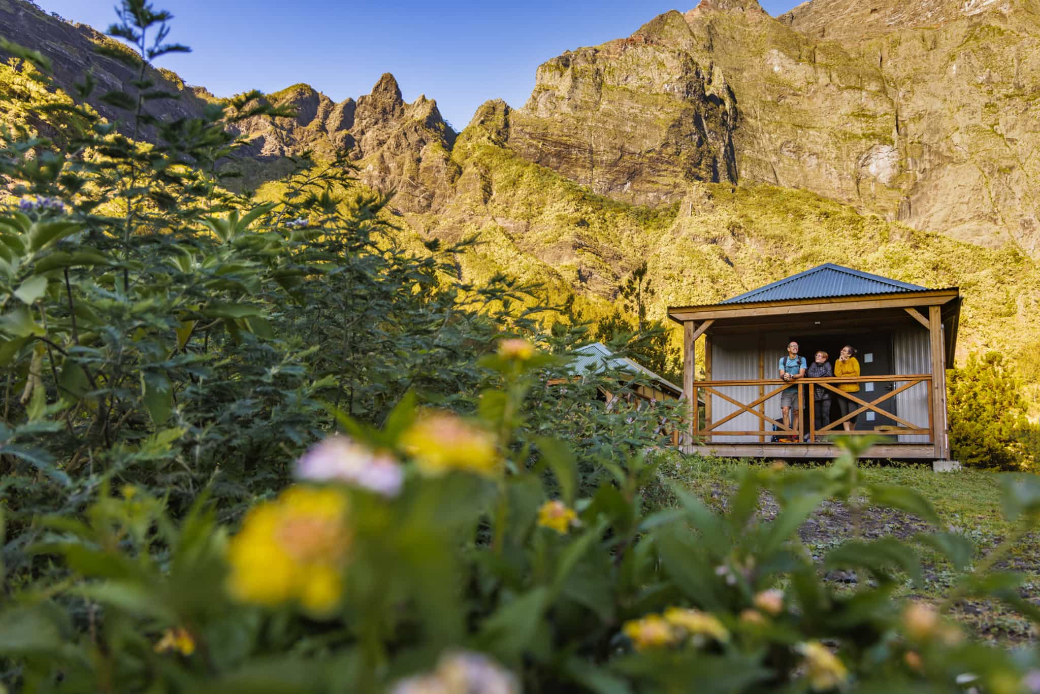 Trekkers resting at a Gite in the Cirque of Mafate, Reunion.