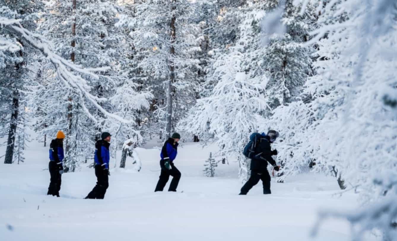 Snowshoeing through the forest in Pyha, Finland.
