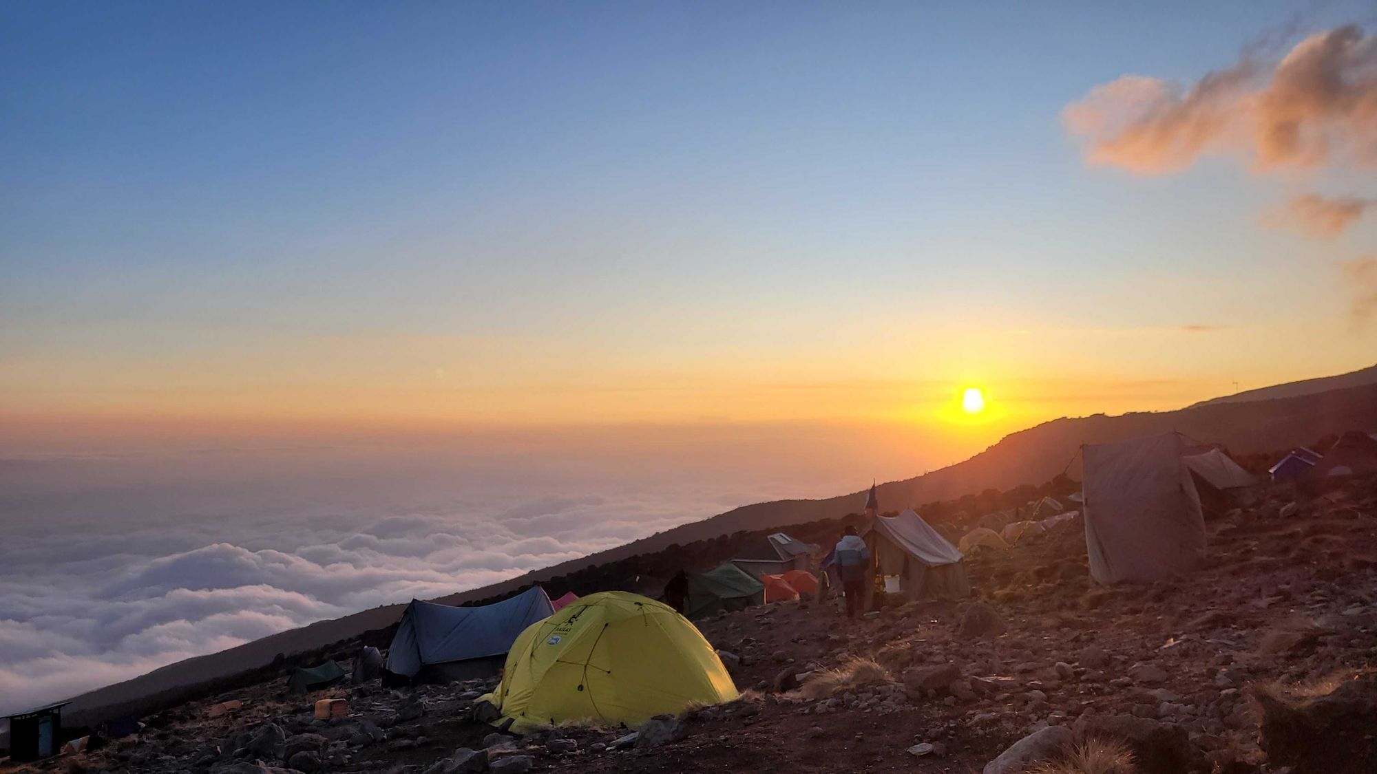 Tents and a cloud inversion at Karanga Camp, Kilimanjaro, Tanzania.