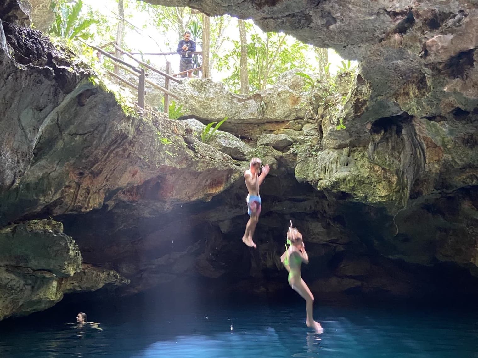 Swimming in Cenote Esmeralda in Mexico. Photo: Mexico Kan Tours. 
