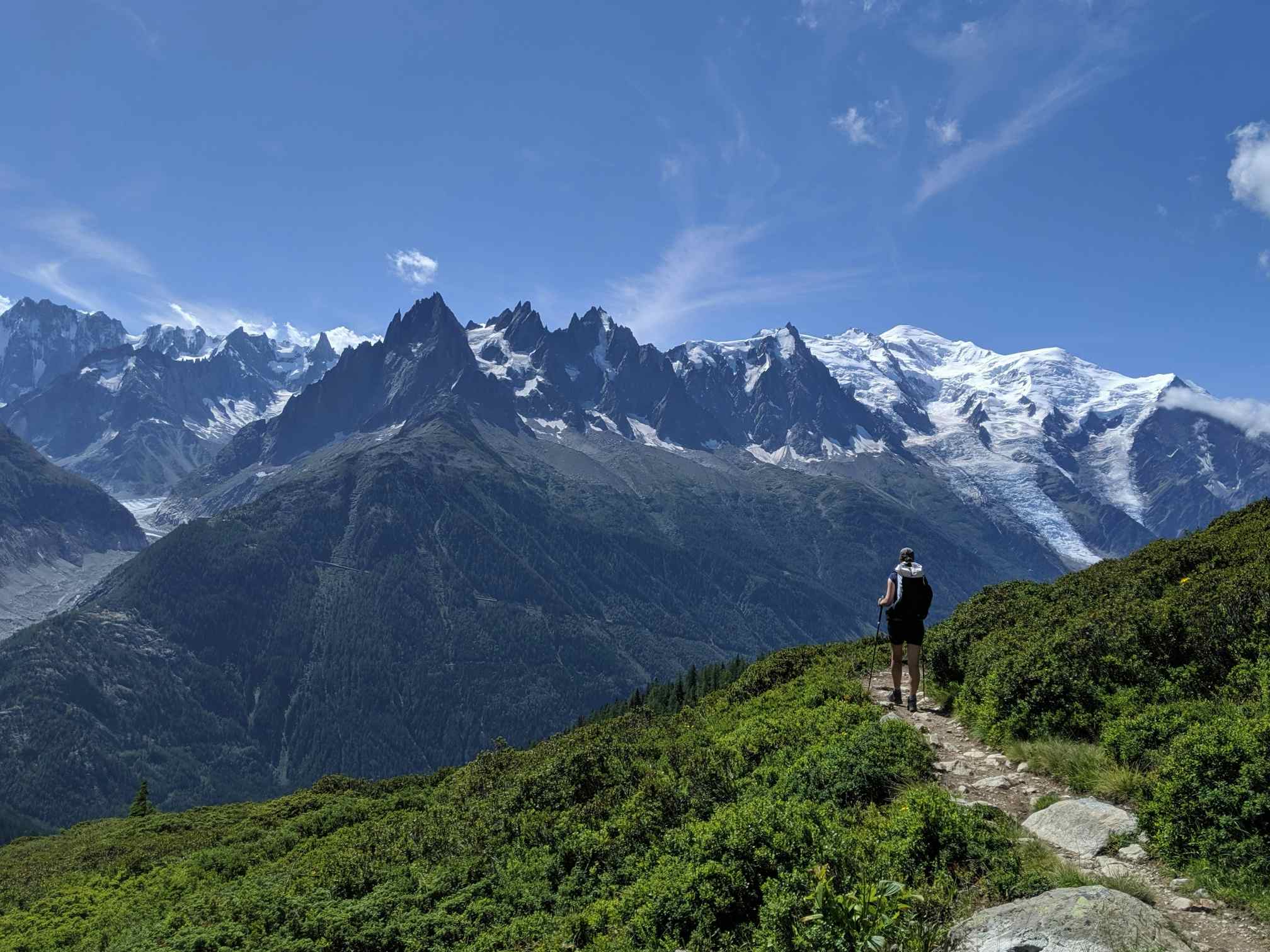 A hiker looks out at the Mont Blanc massif. Photo: Canva.