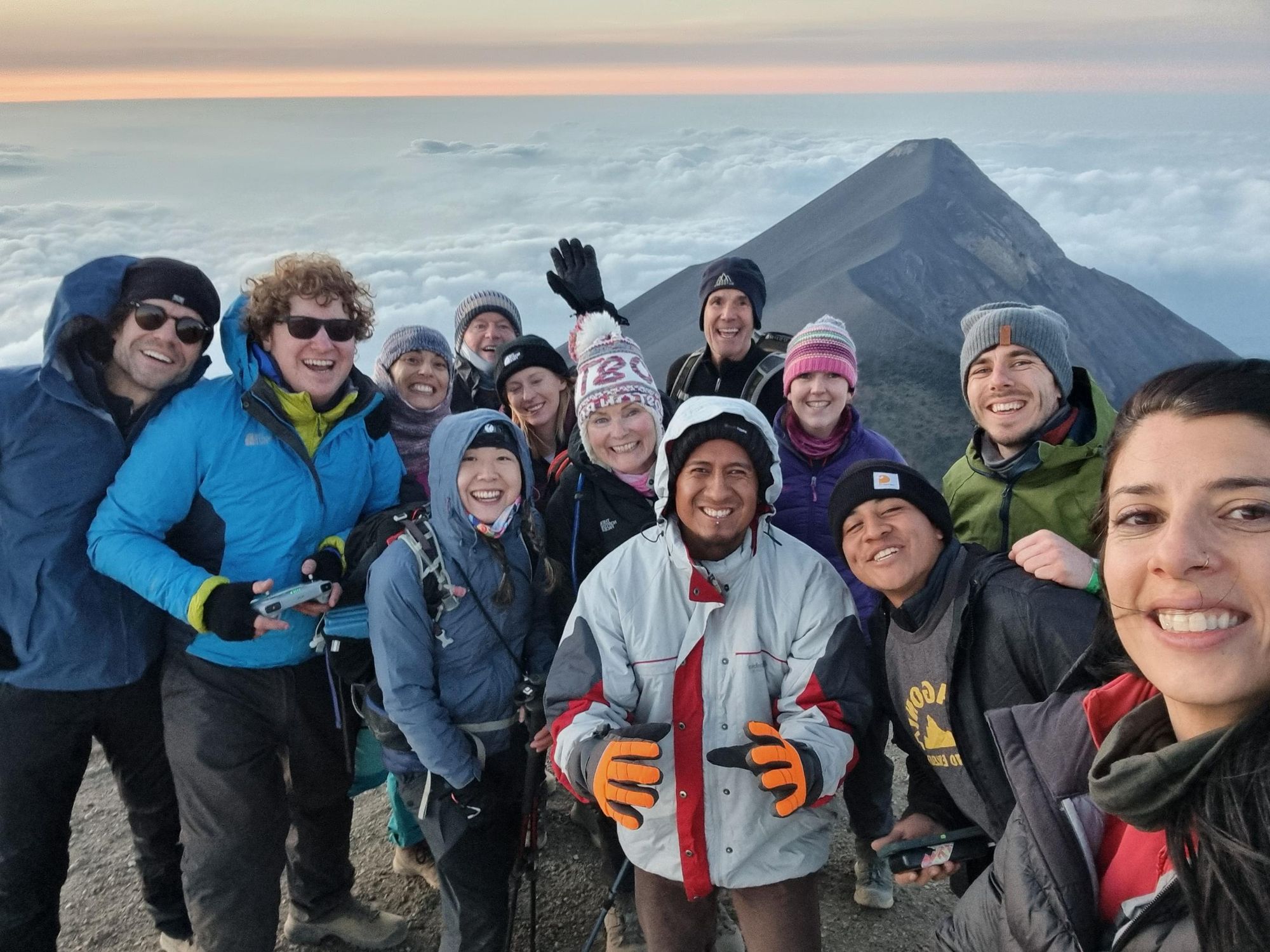Hikers celebrate on the summit of Acatenango. Photo: Marta Marinelli.